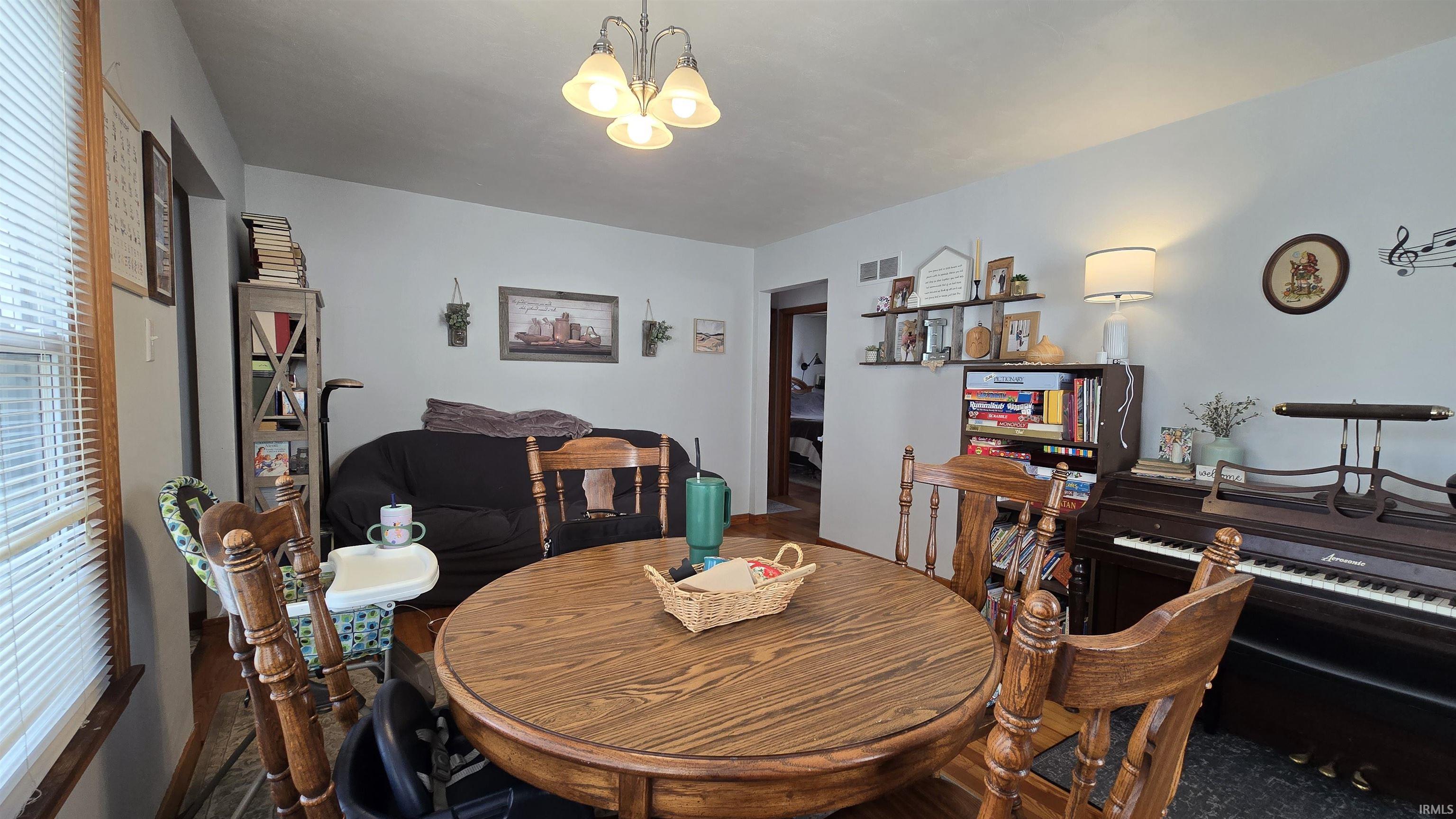 Dining area with a chandelier