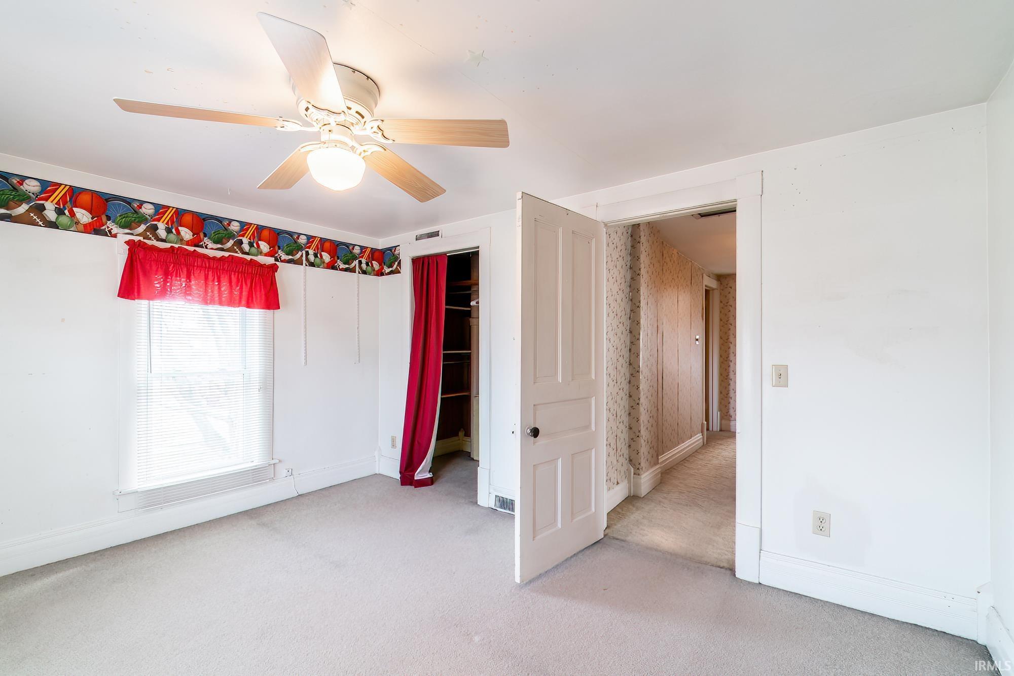 Bedroom 3 with carpet flooring and a ceiling fan