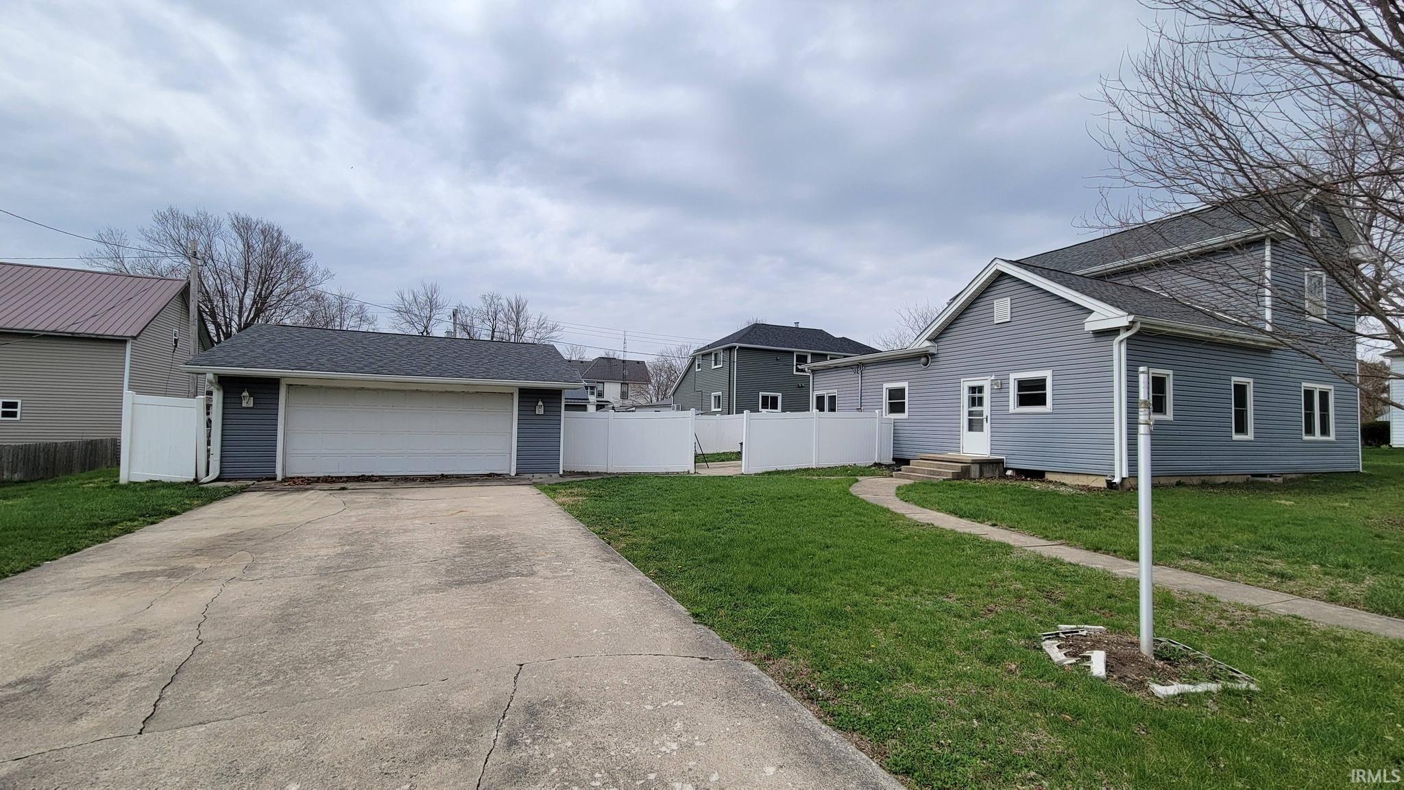 View of front of home featuring an outbuilding, a garage, and entry steps