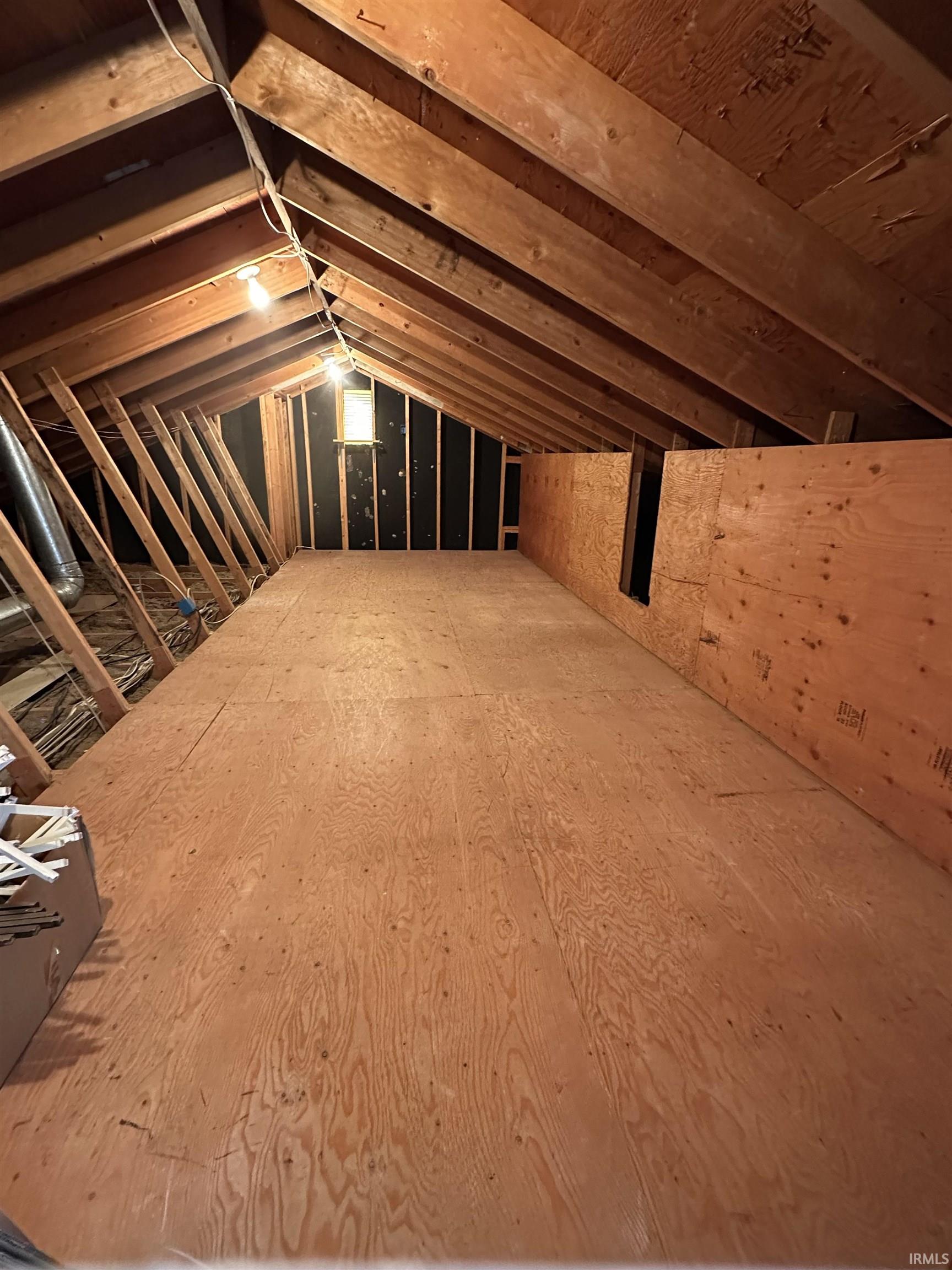 Walk in attic from 4th bedroom - also accessible to pull down stairs from the garage.