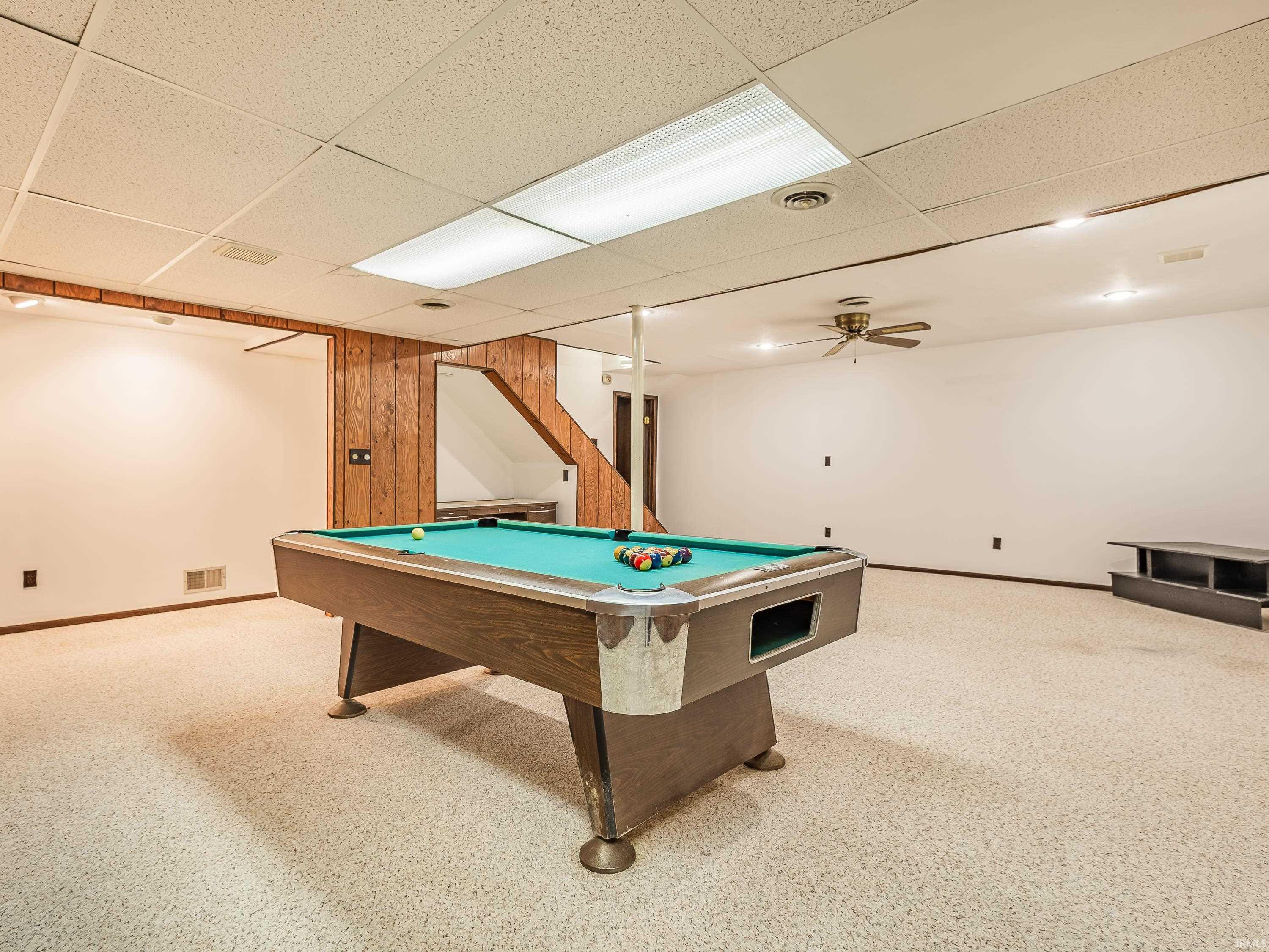 Recreation room with light colored carpet, billiards, a paneled ceiling, and ventilation fans to circulate air