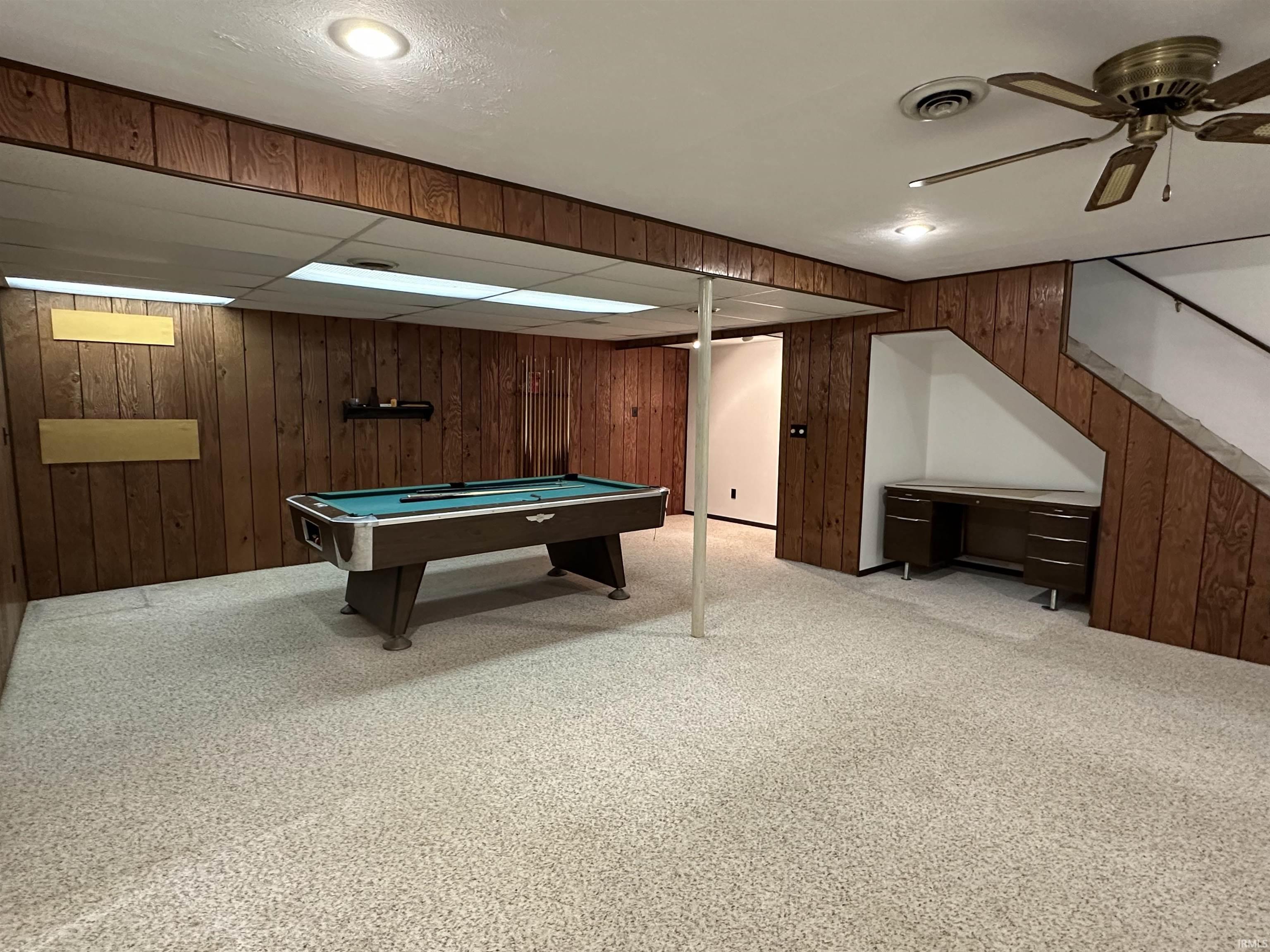 Tv area plus pool table area, desk nook, and refrigerator/bar nook.