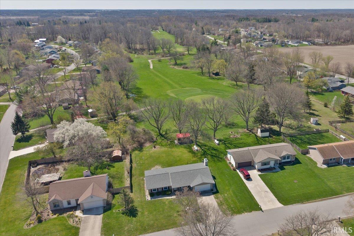 Aerial perspective of suburban area featuring a golf club
