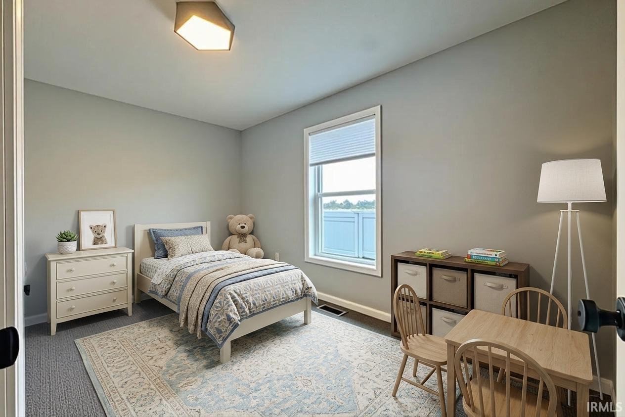 Wall-to-wall carpeting with a decorative area rug