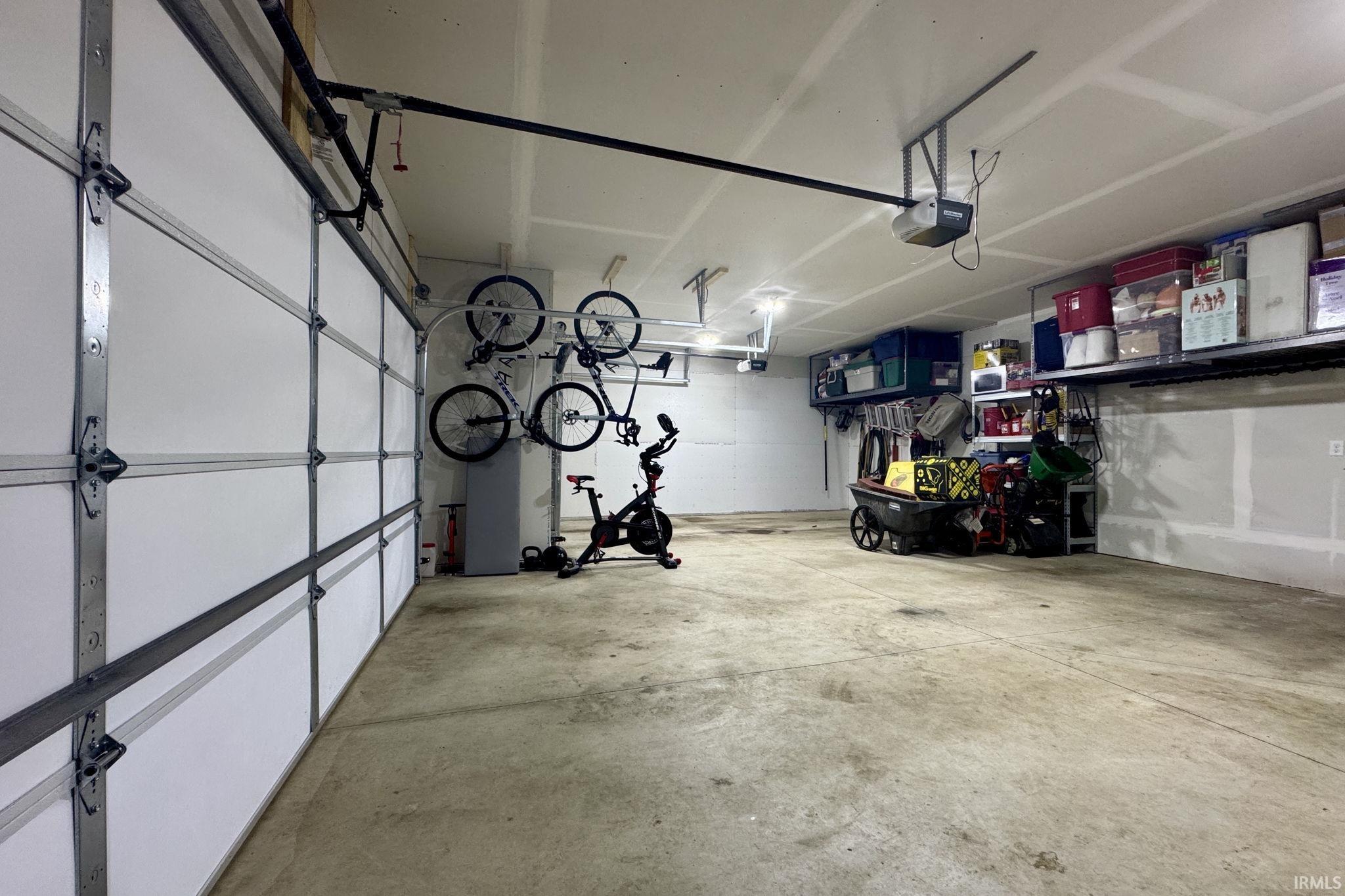 Garage featuring a garage door opener