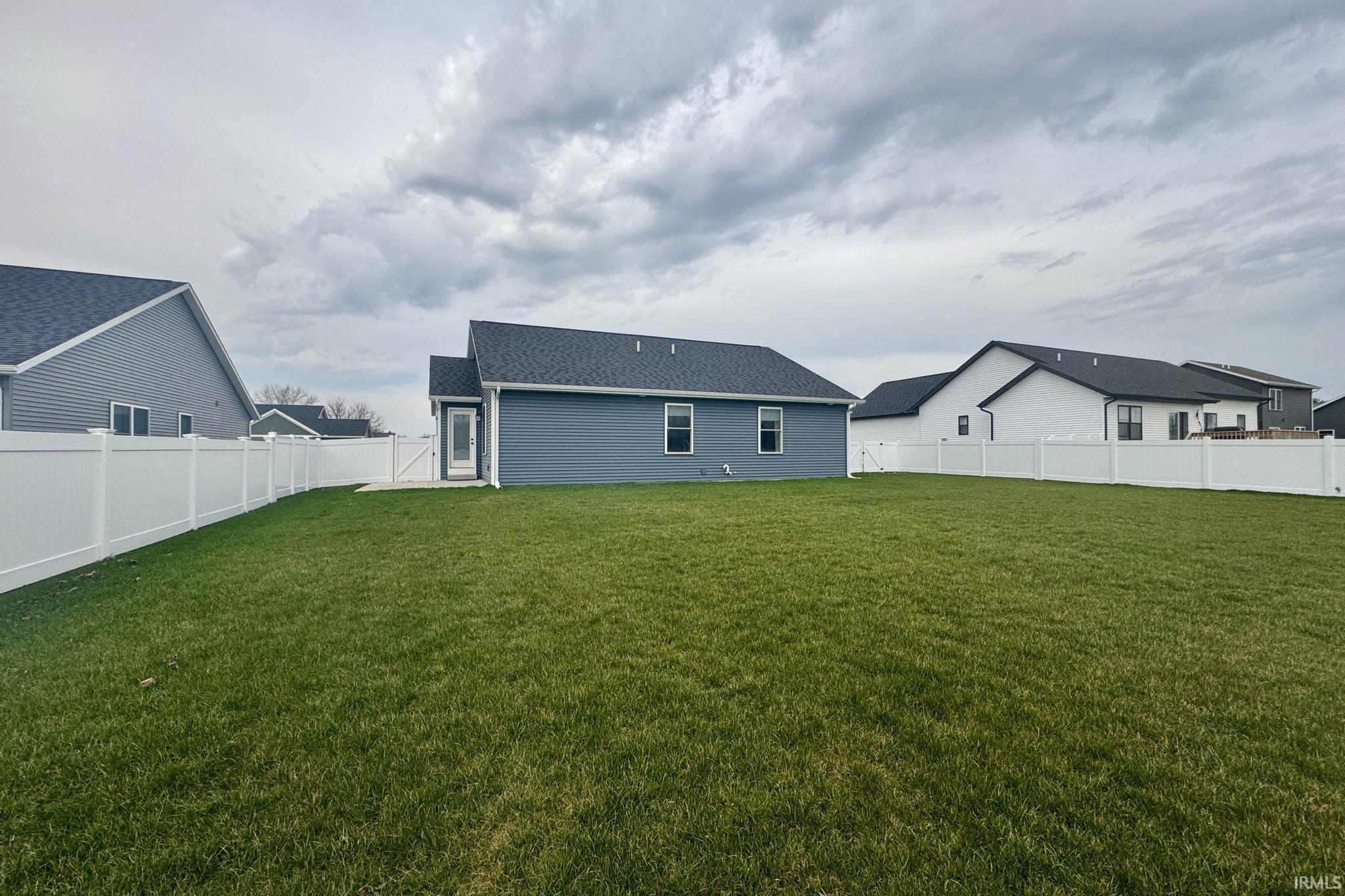 Back of house featuring a fenced backyard