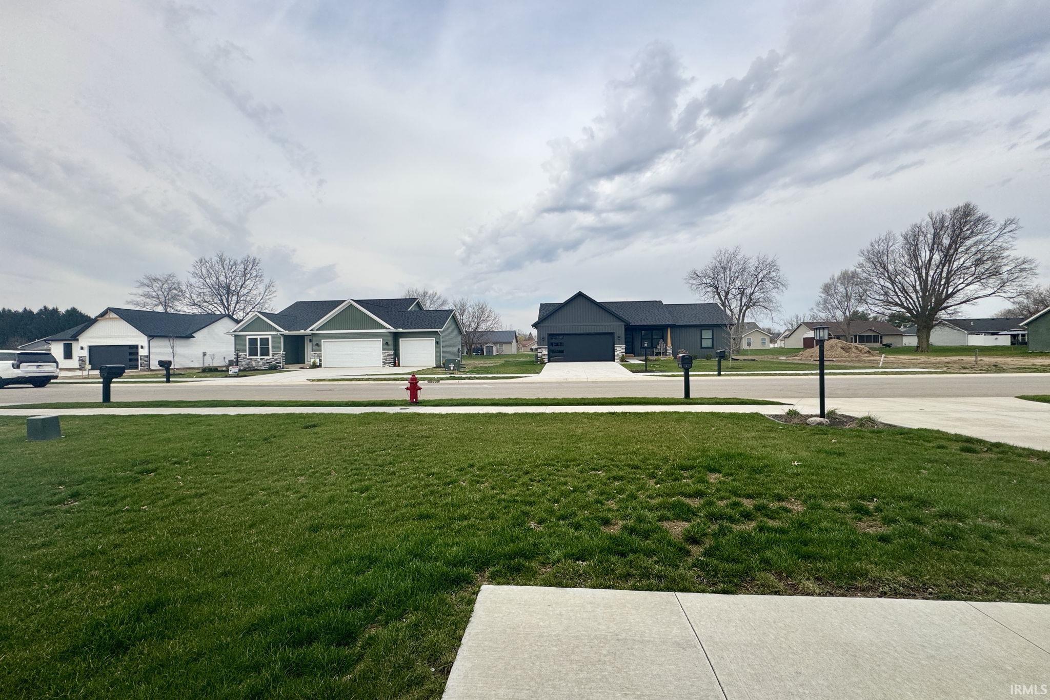 View of grassy yard featuring a residential view