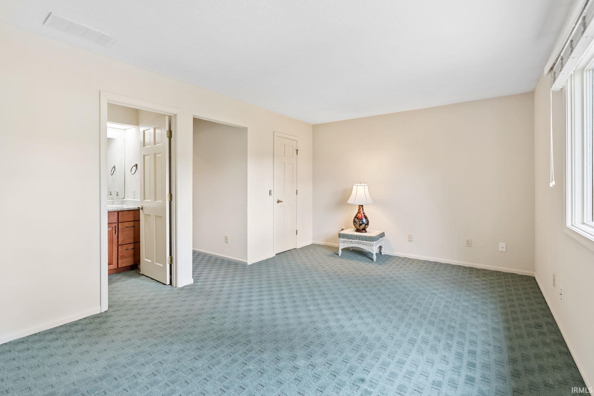 Unfurnished room featuring carpet