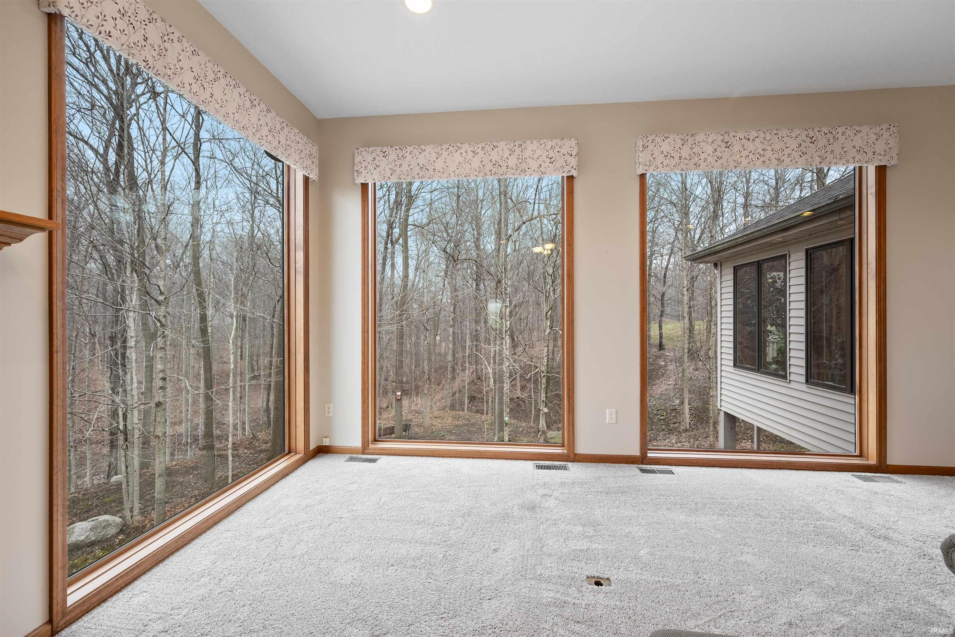 Unfurnished sunroom with plenty of natural light