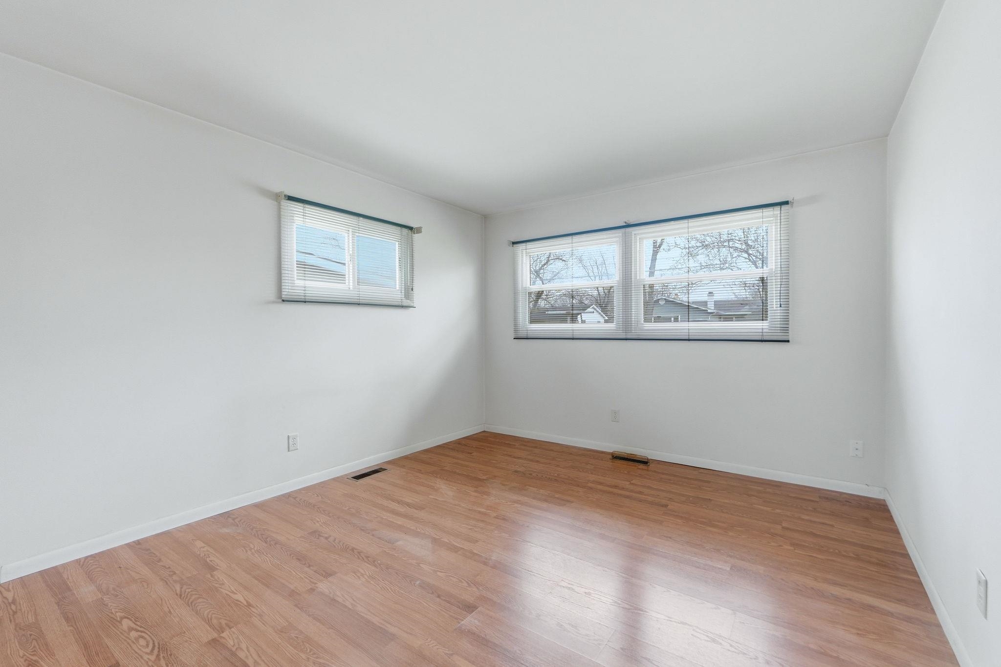Unfurnished room featuring light wood-style flooring and plenty of natural light
