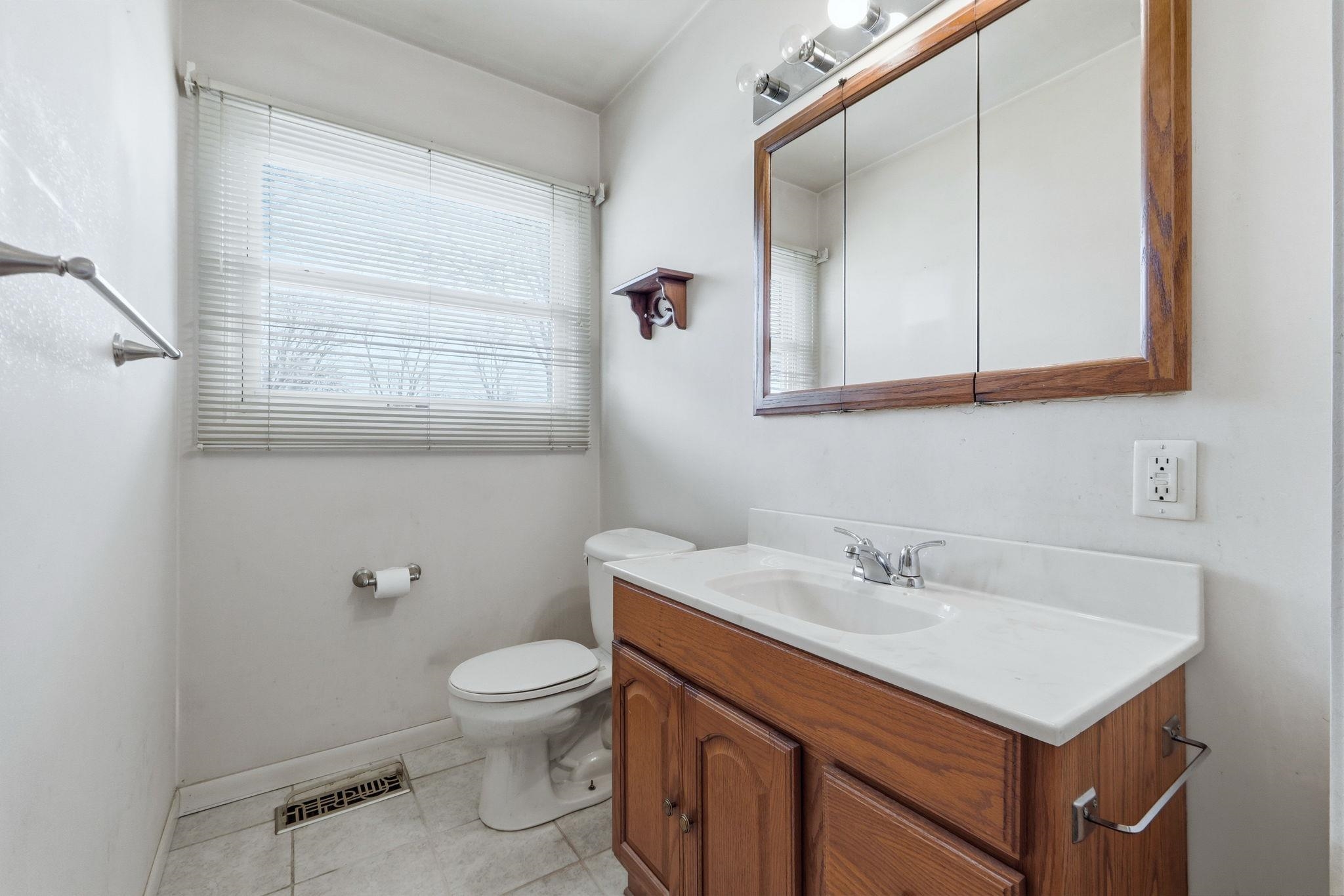Bathroom featuring vanity and light tile patterned floors