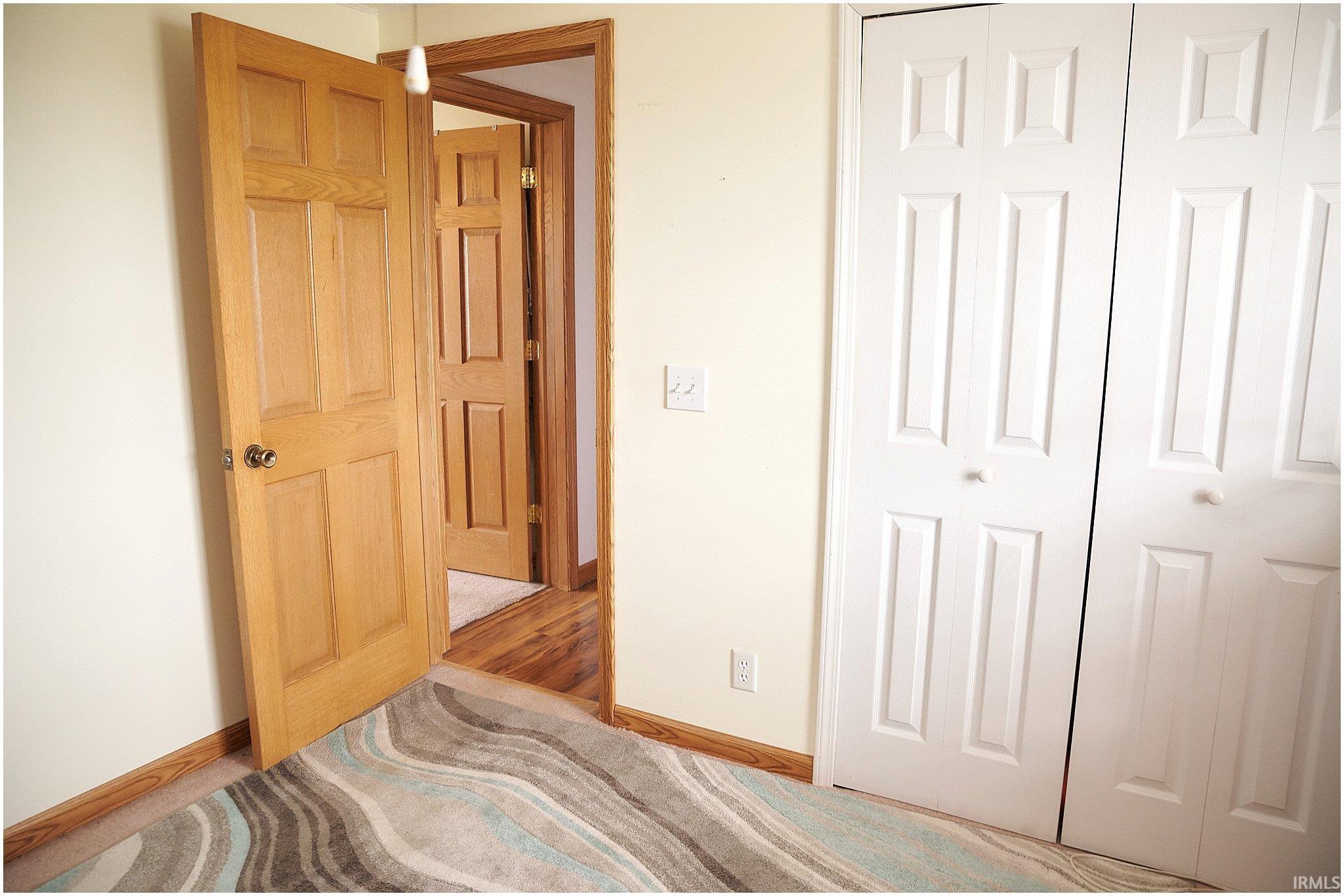 Bedroom featuring baseboards and a closet