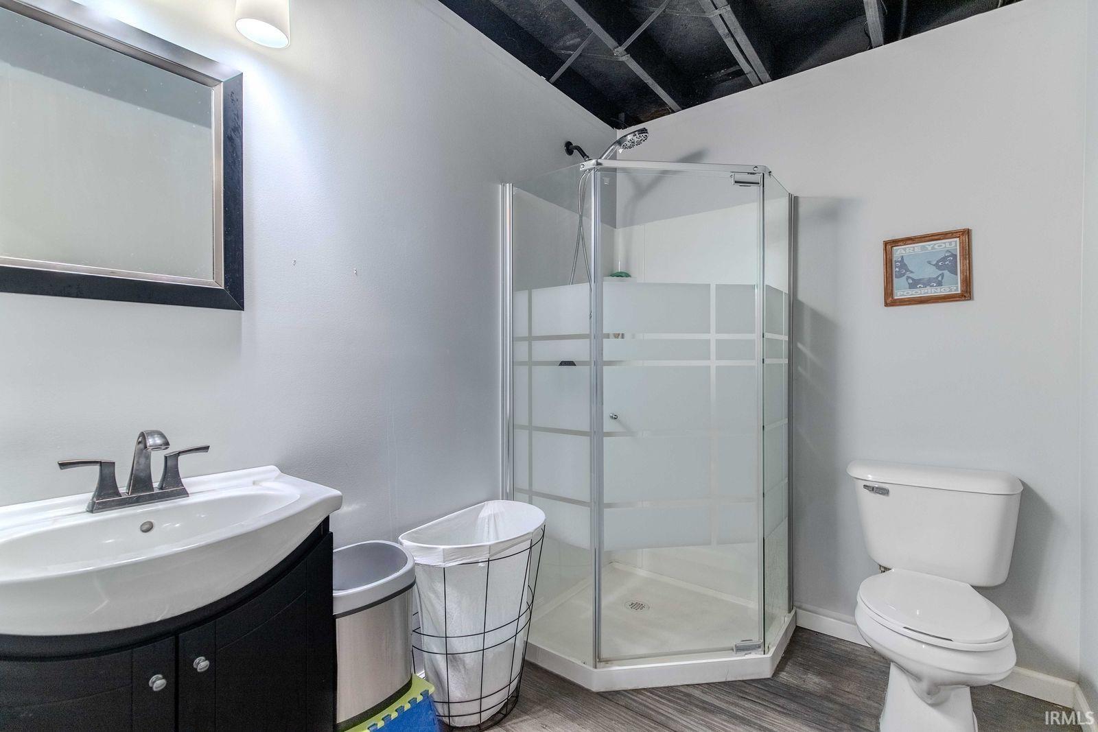 Bathroom with vanity and a shower stall