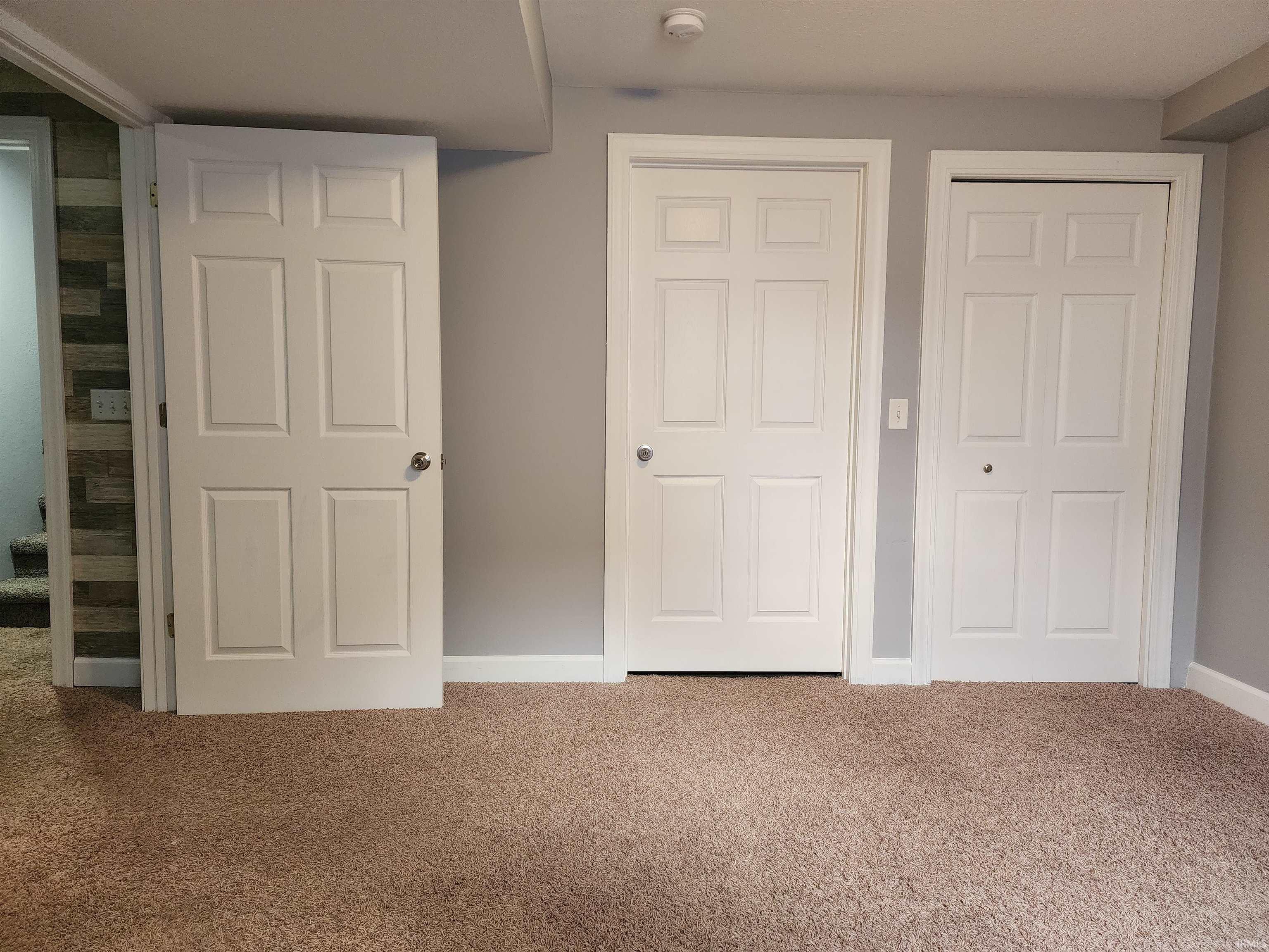 Unfurnished bedroom with carpet