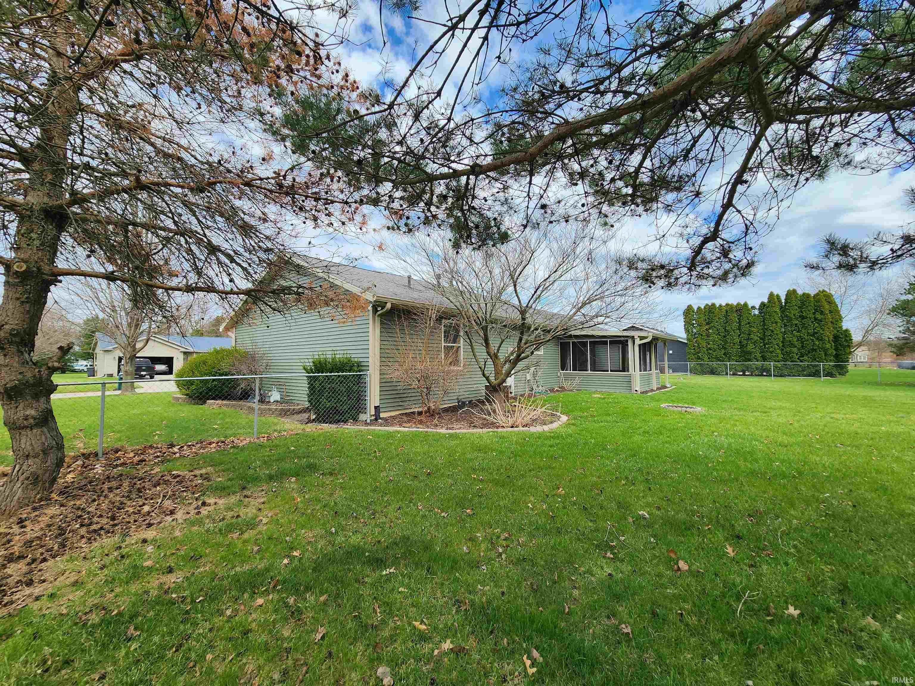 View of side of property with a fenced backyard