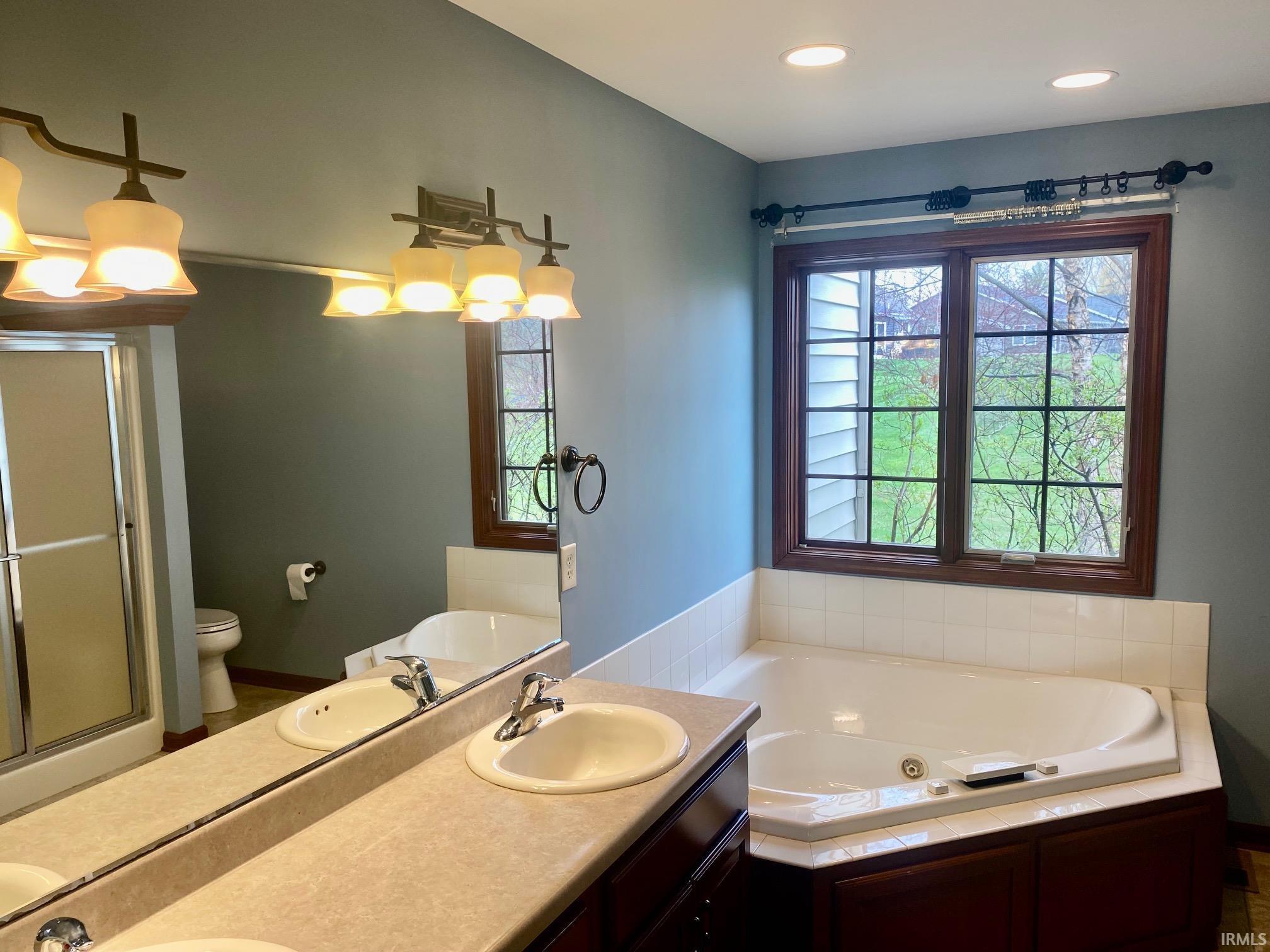 Bathroom with a whirlpool tub and double vanity