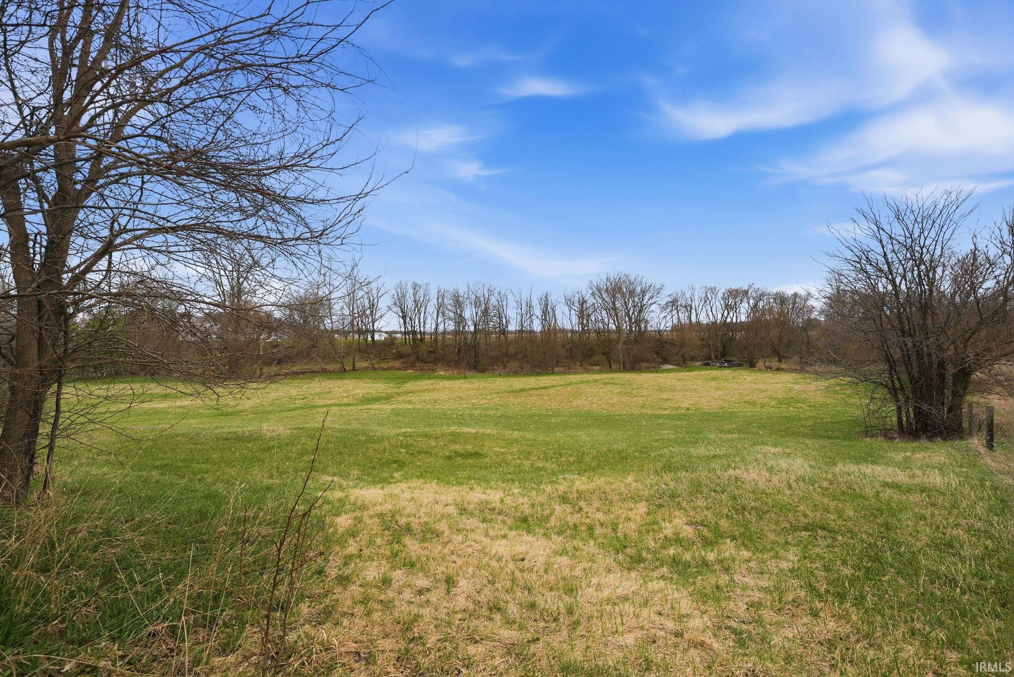 View of green lawn featuring a view of rural / pastoral area