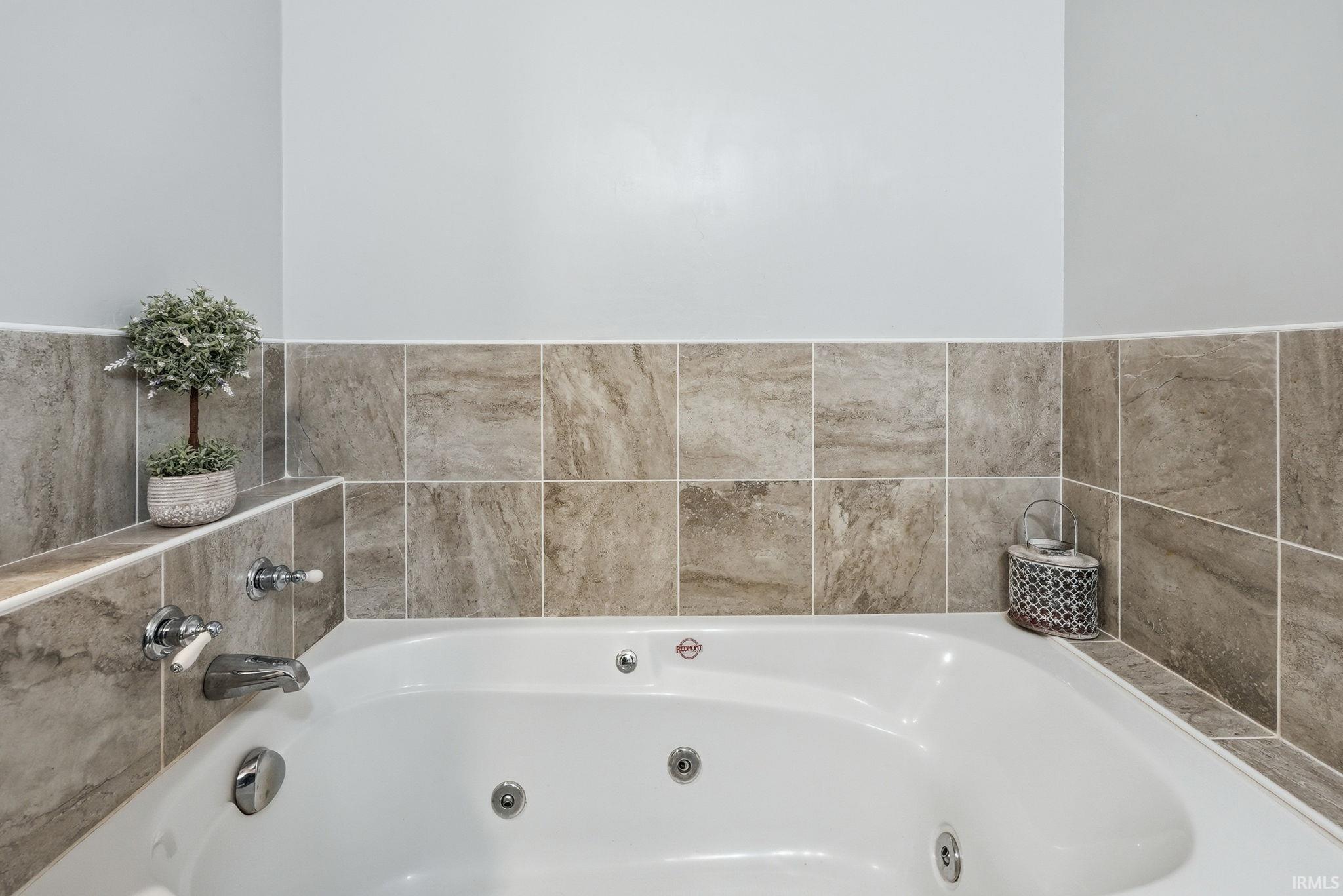 Bathroom with a jetted tub