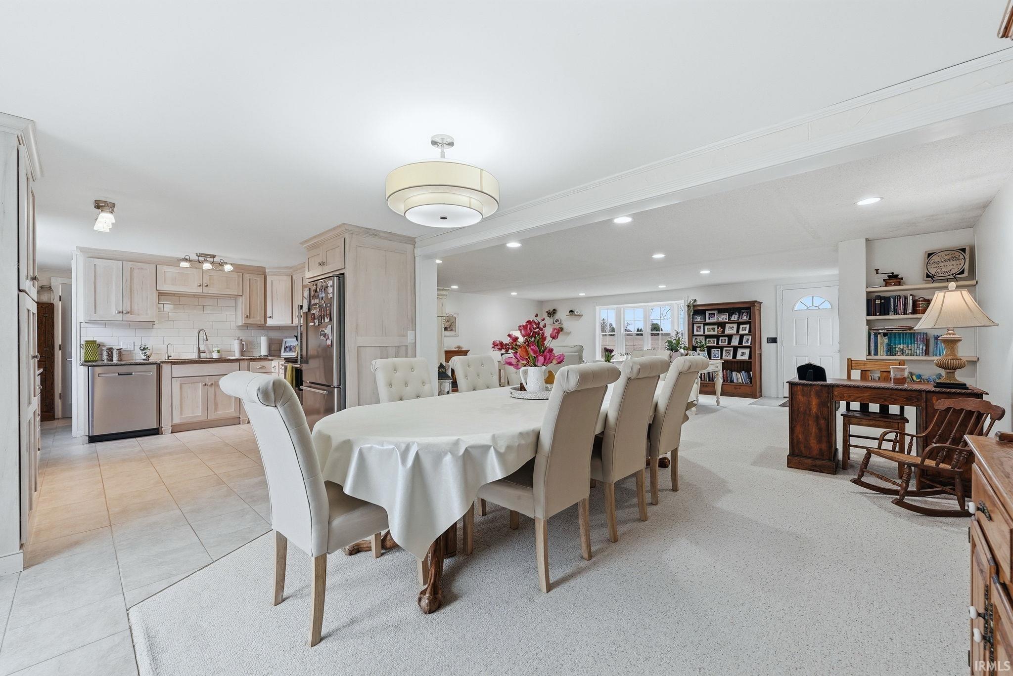 Dining room with light tile patterned floors