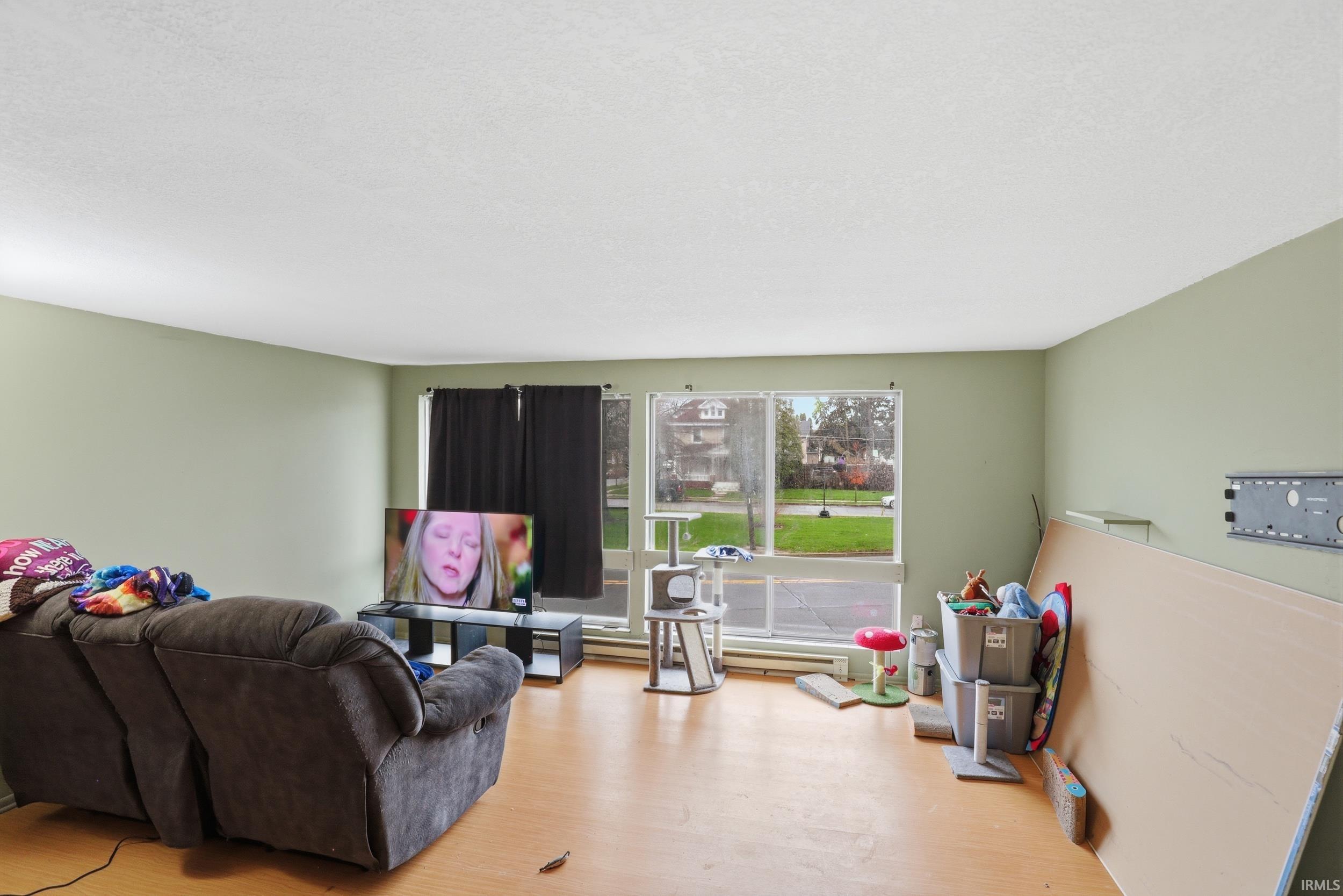 Living room featuring light wood-style floors