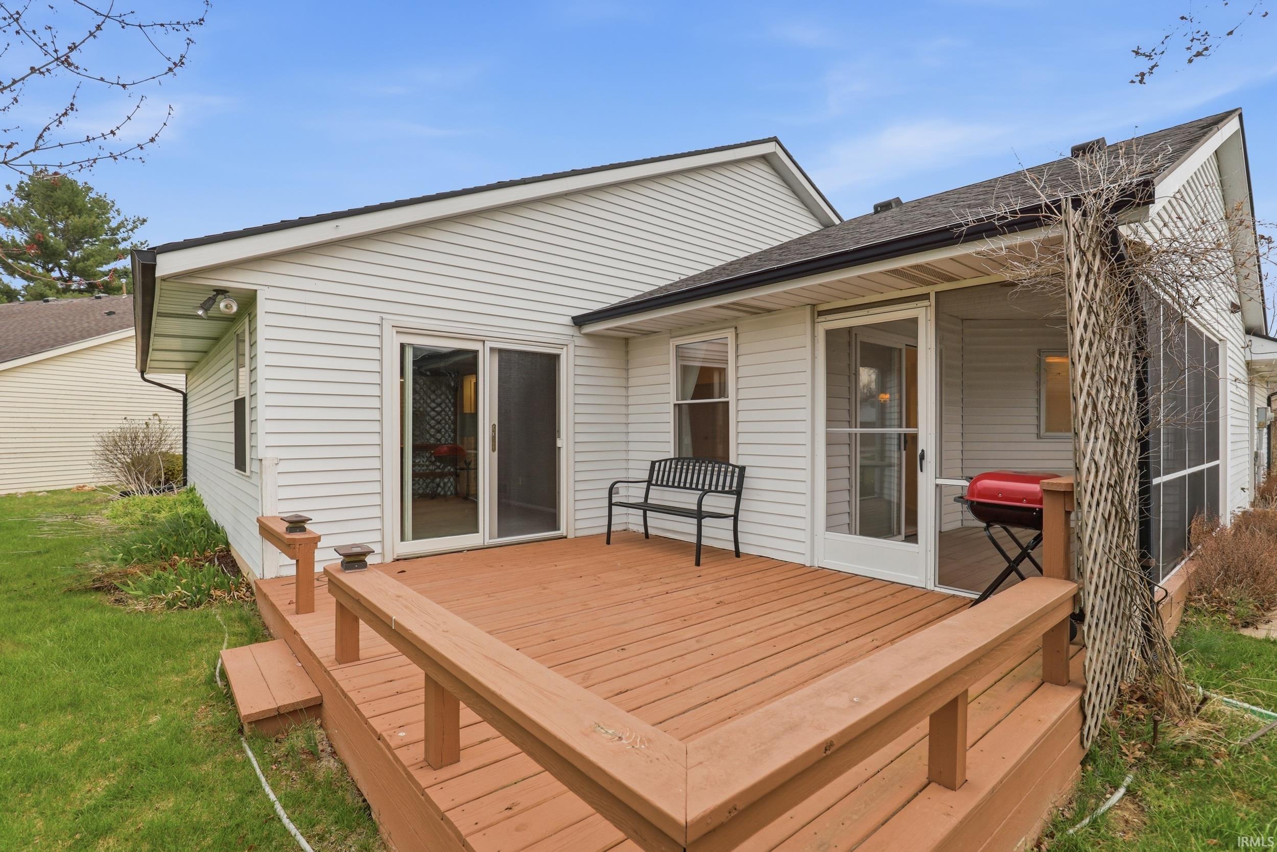 Wooden deck featuring a yard
