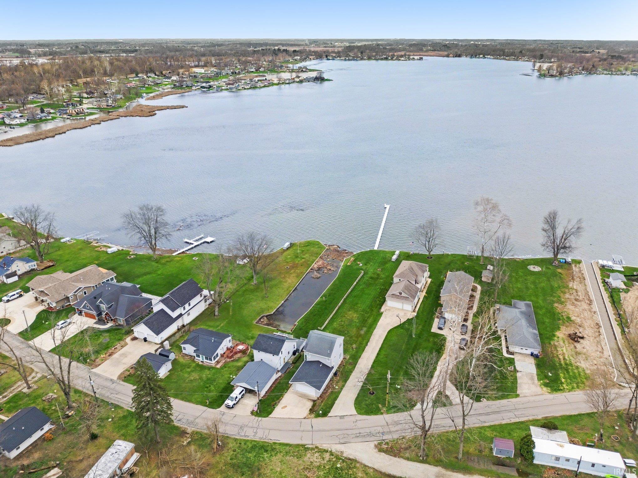 Aerial perspective of suburban area with a large body of water