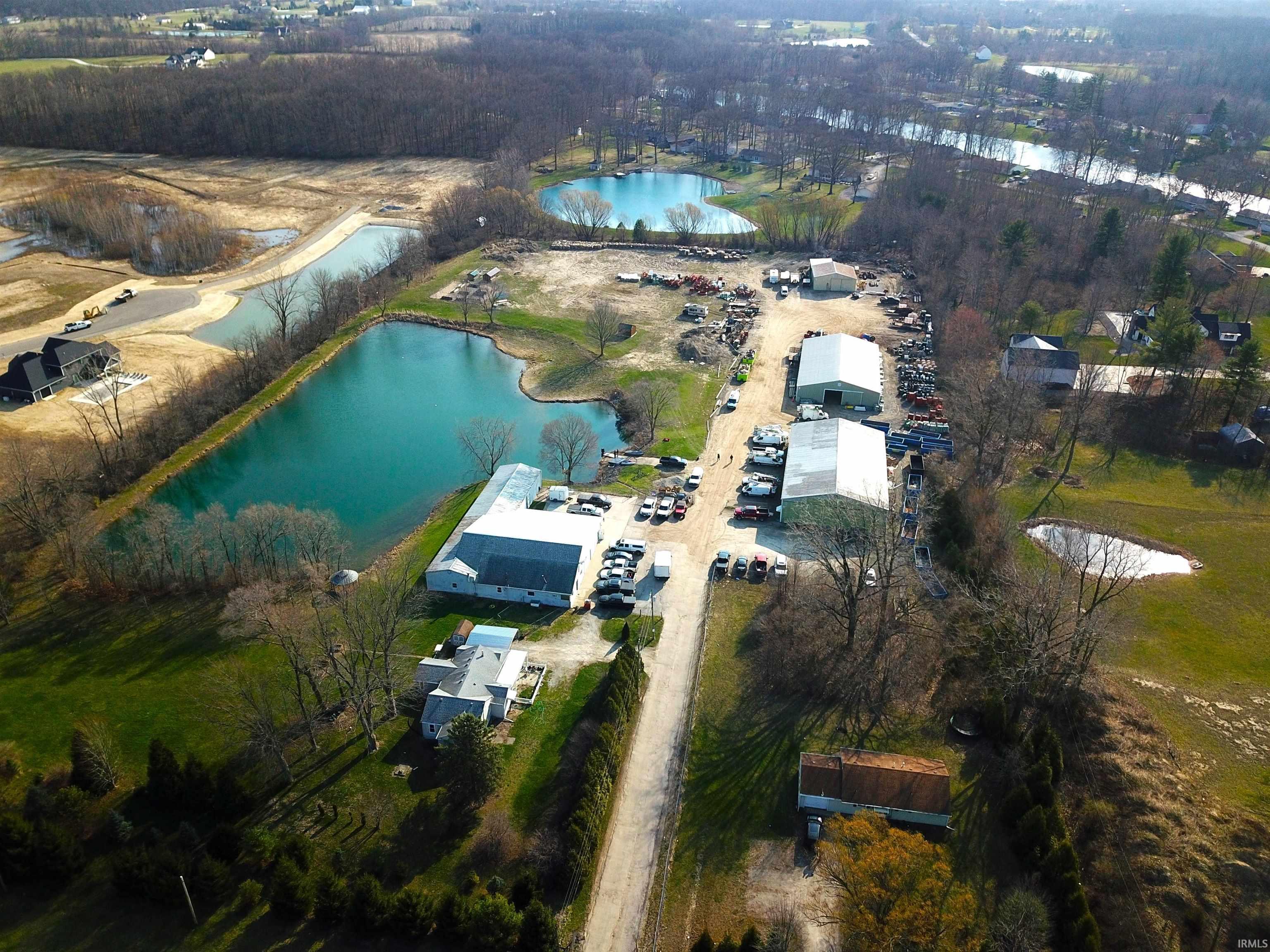 Aerial view of property's location featuring a large body of water