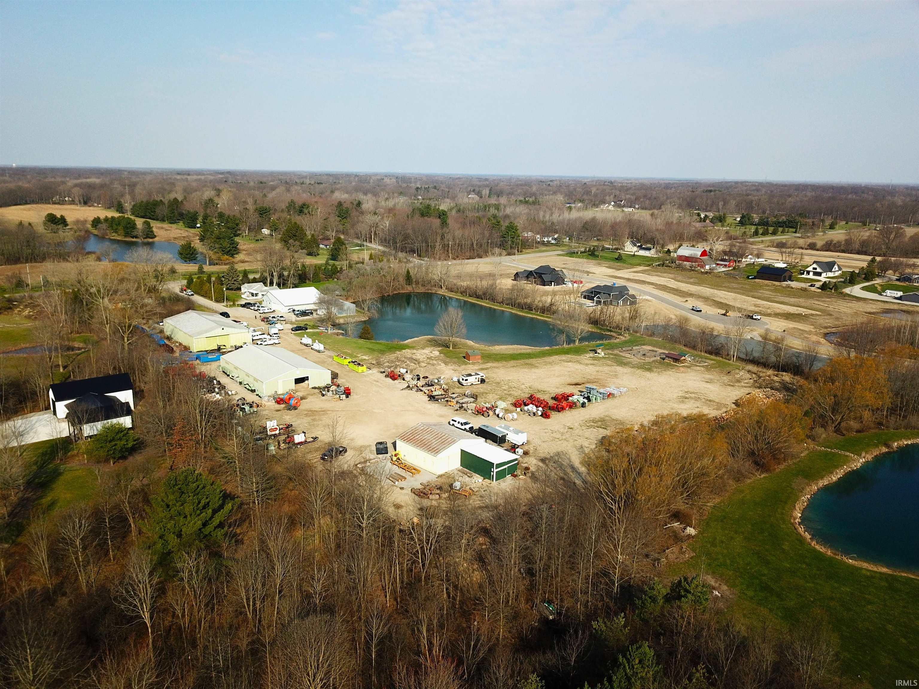 Aerial overview of property's location with a nearby body of water