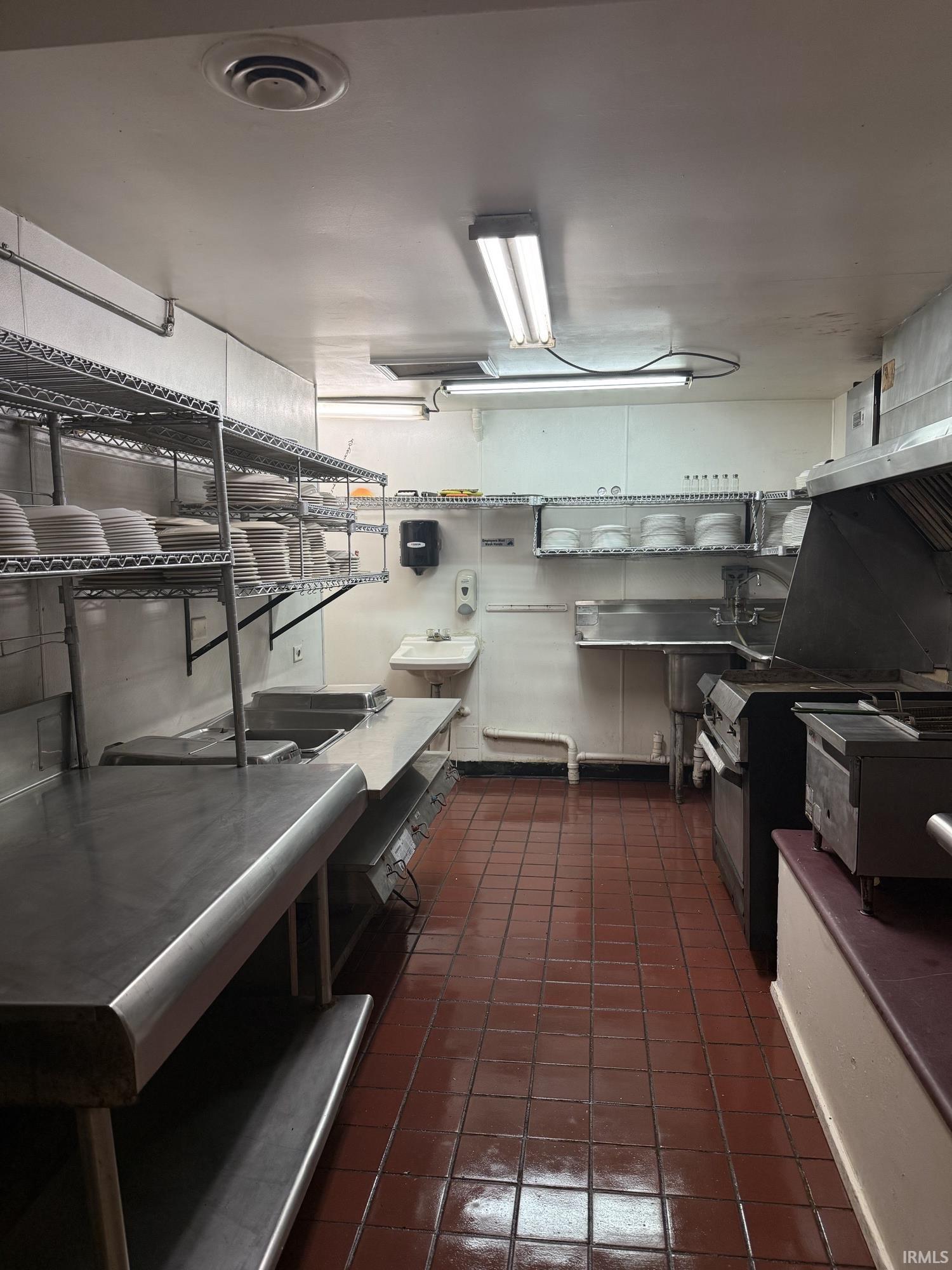 Kitchen featuring slide in range oven