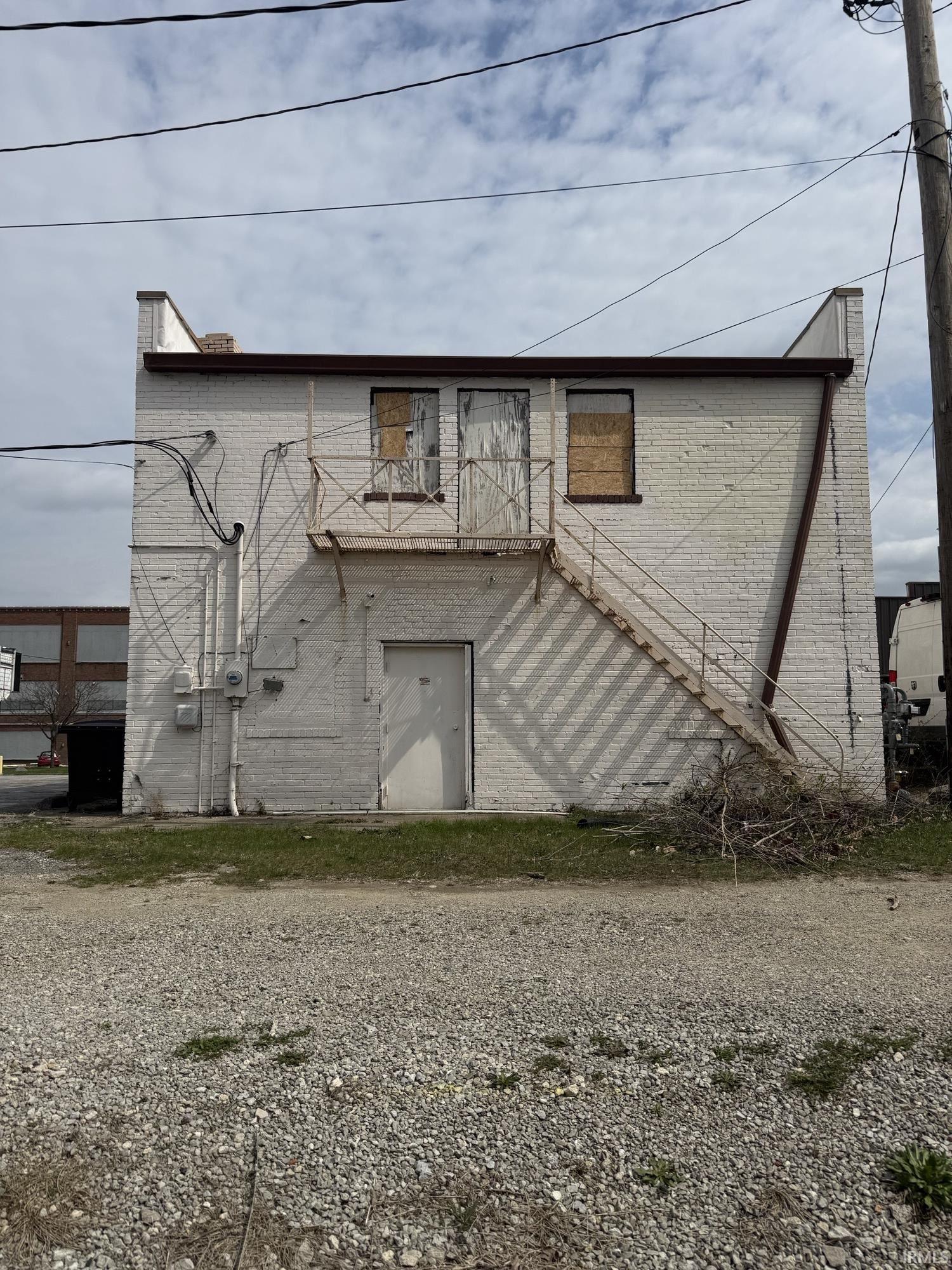 View of building exterior featuring stairway