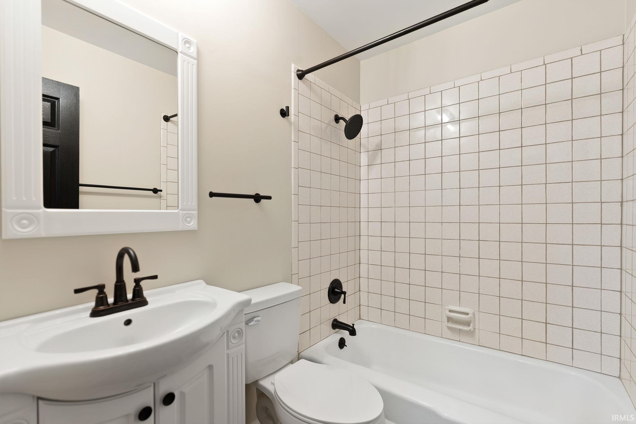 Full bathroom featuring vanity and bathtub / shower combination