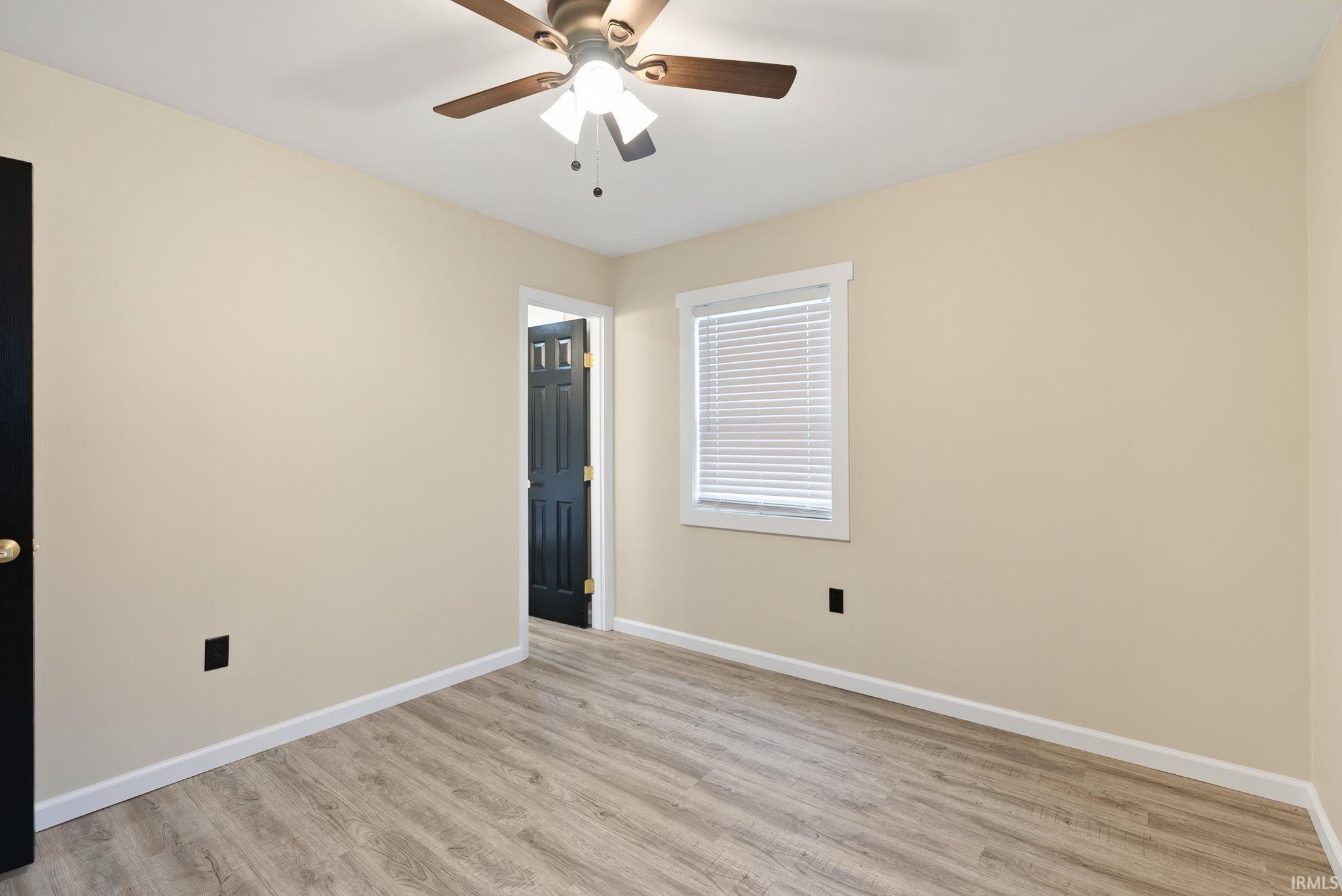 Unfurnished bedroom featuring light wood finished floors and ceiling fan