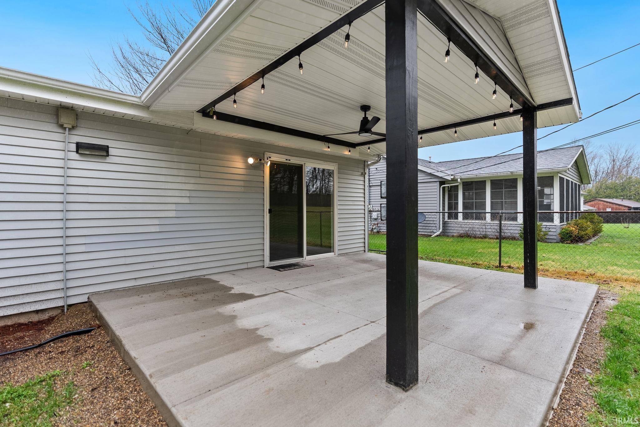 View of patio featuring a ceiling fan