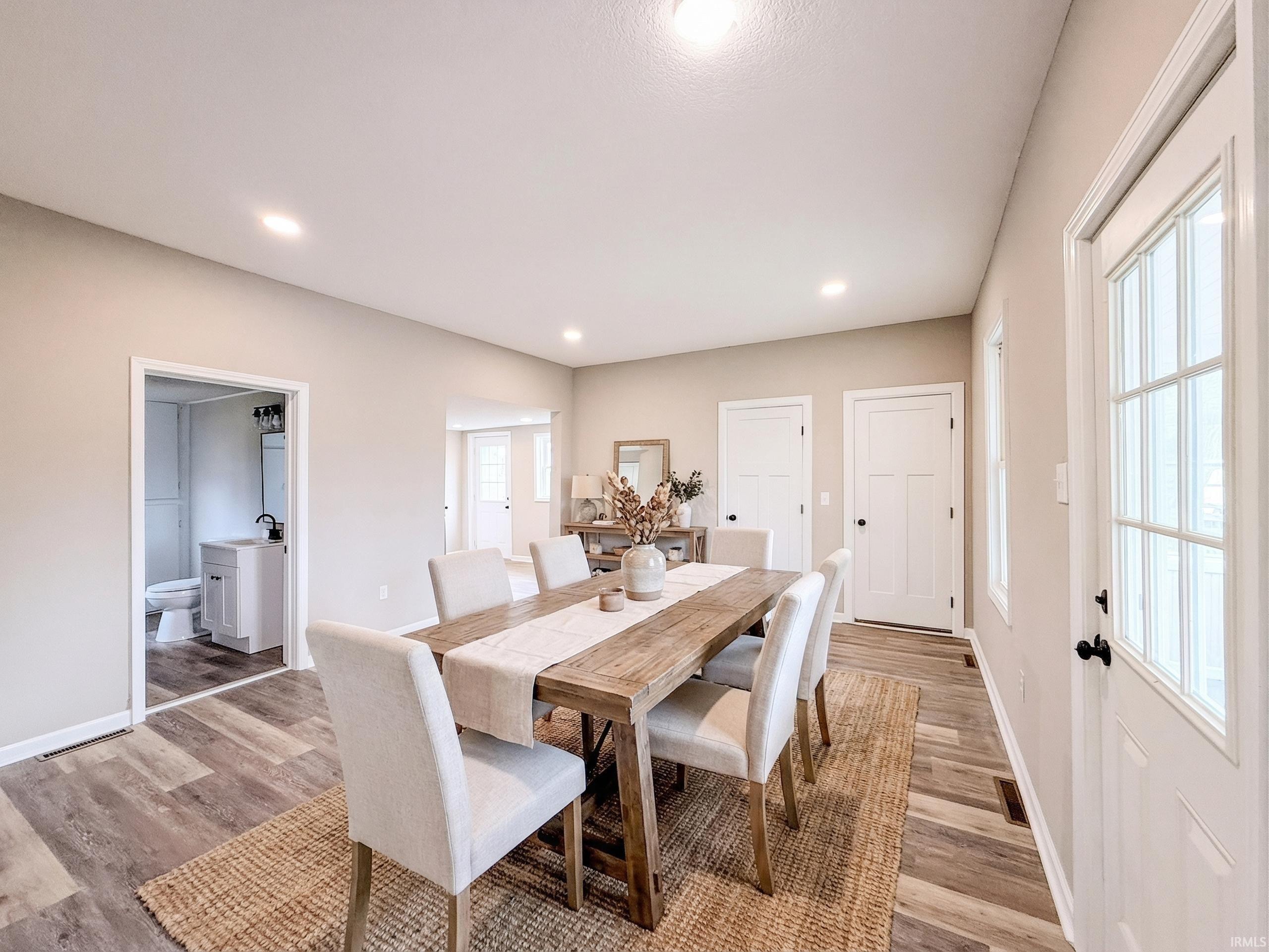 Dining room featuring light wood-style floors and recessed lighting