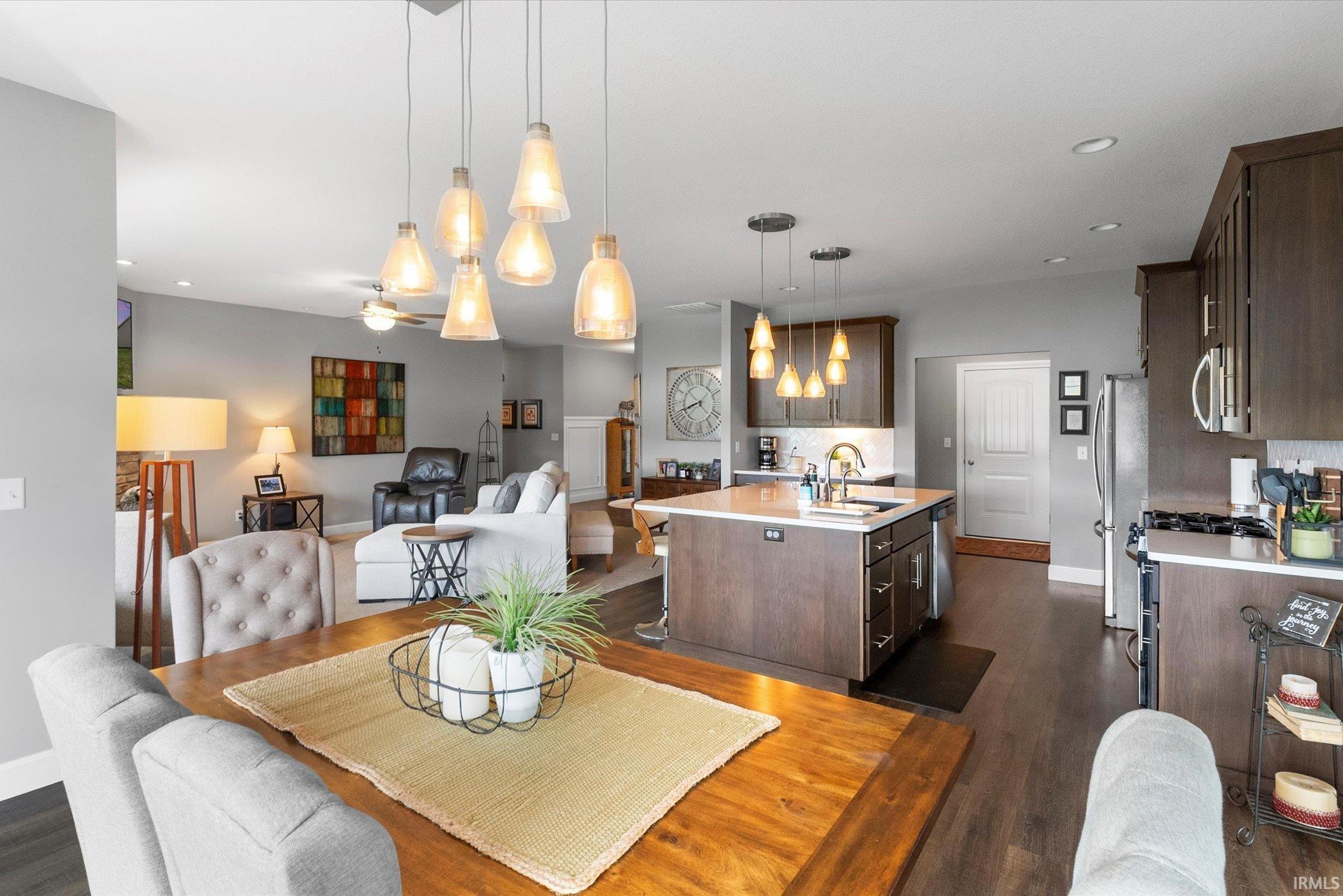 Dining room featuring dark wood finished floors and recessed lighting