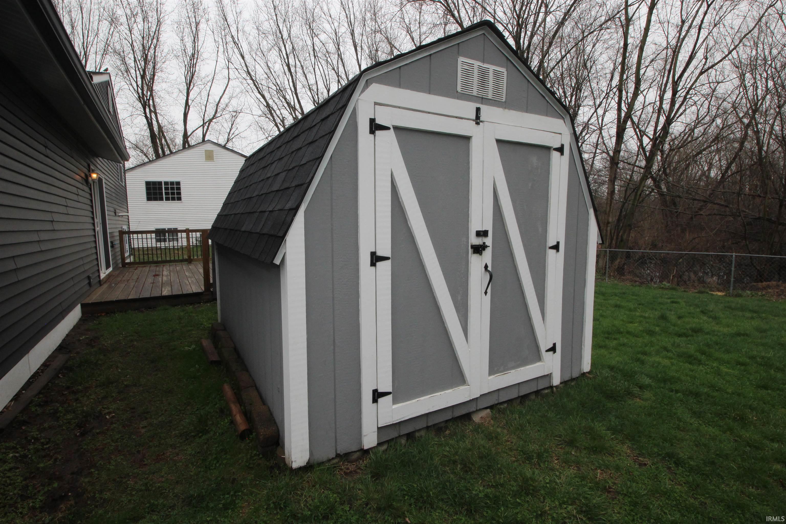 View of shed featuring a fenced backyard