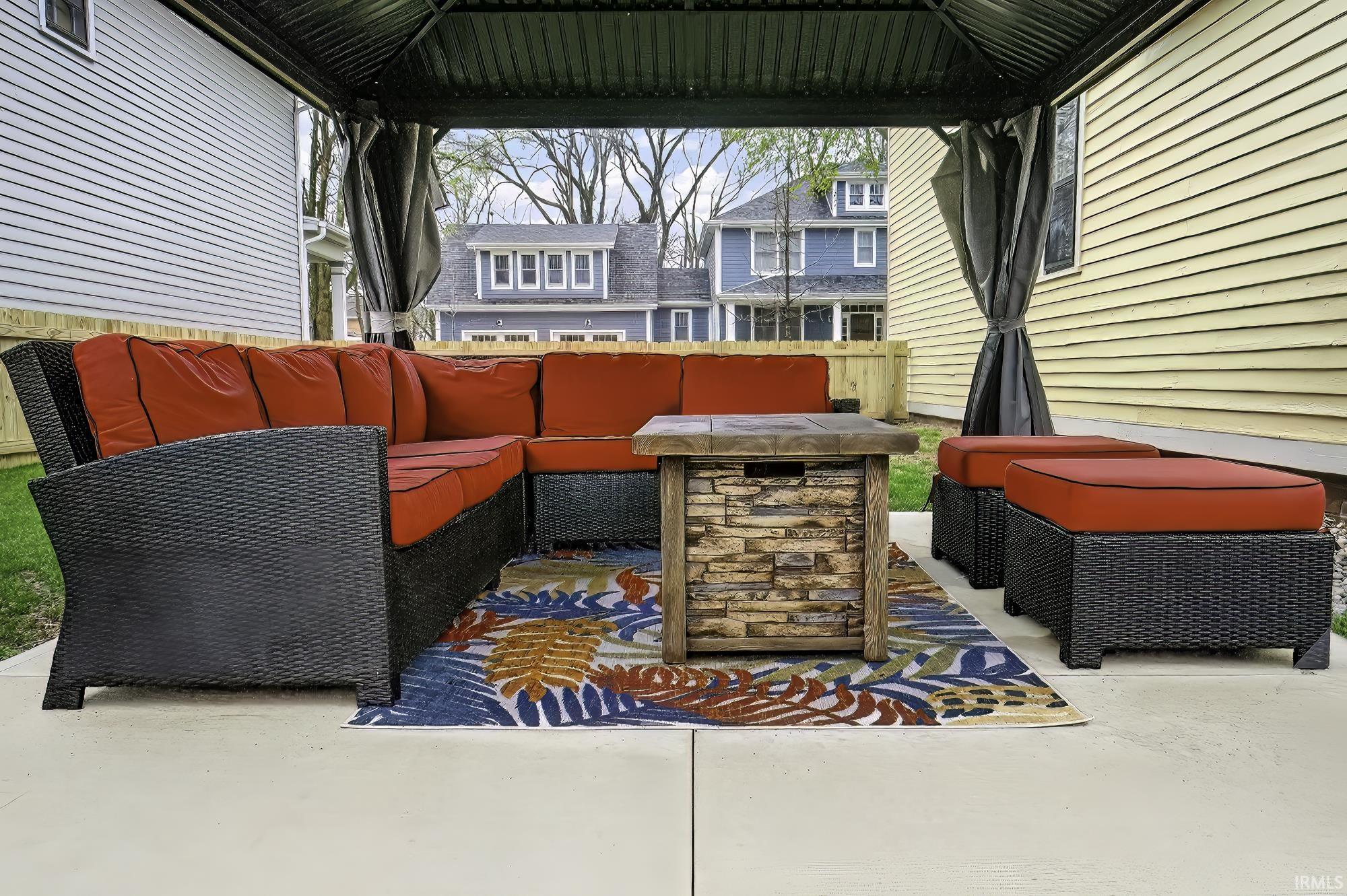 View of patio with an outdoor hangout area and a gazebo