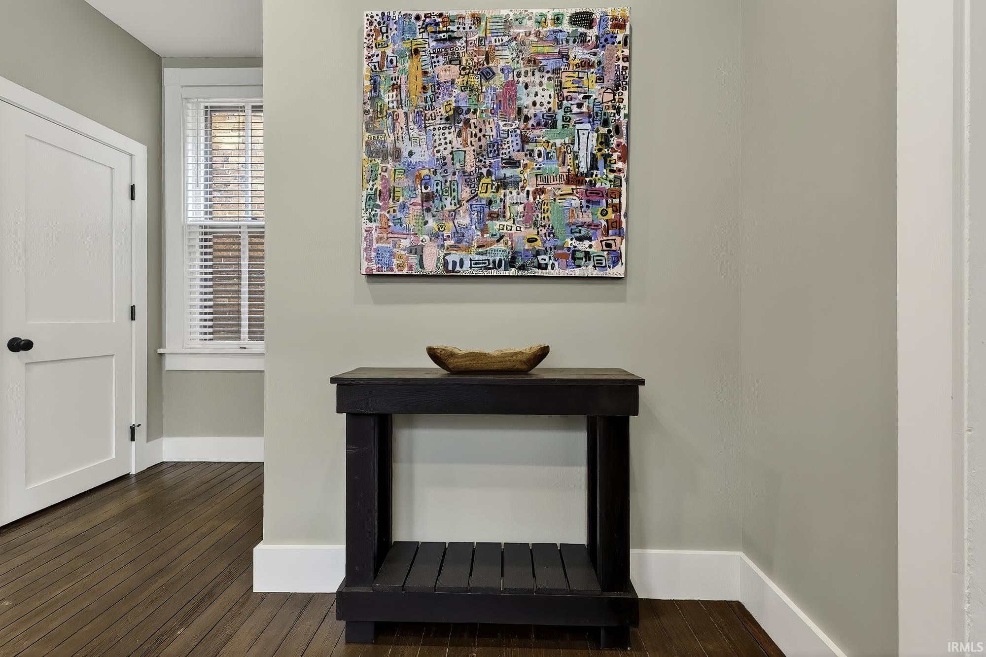 Detailed view of wood finished floors and baseboards