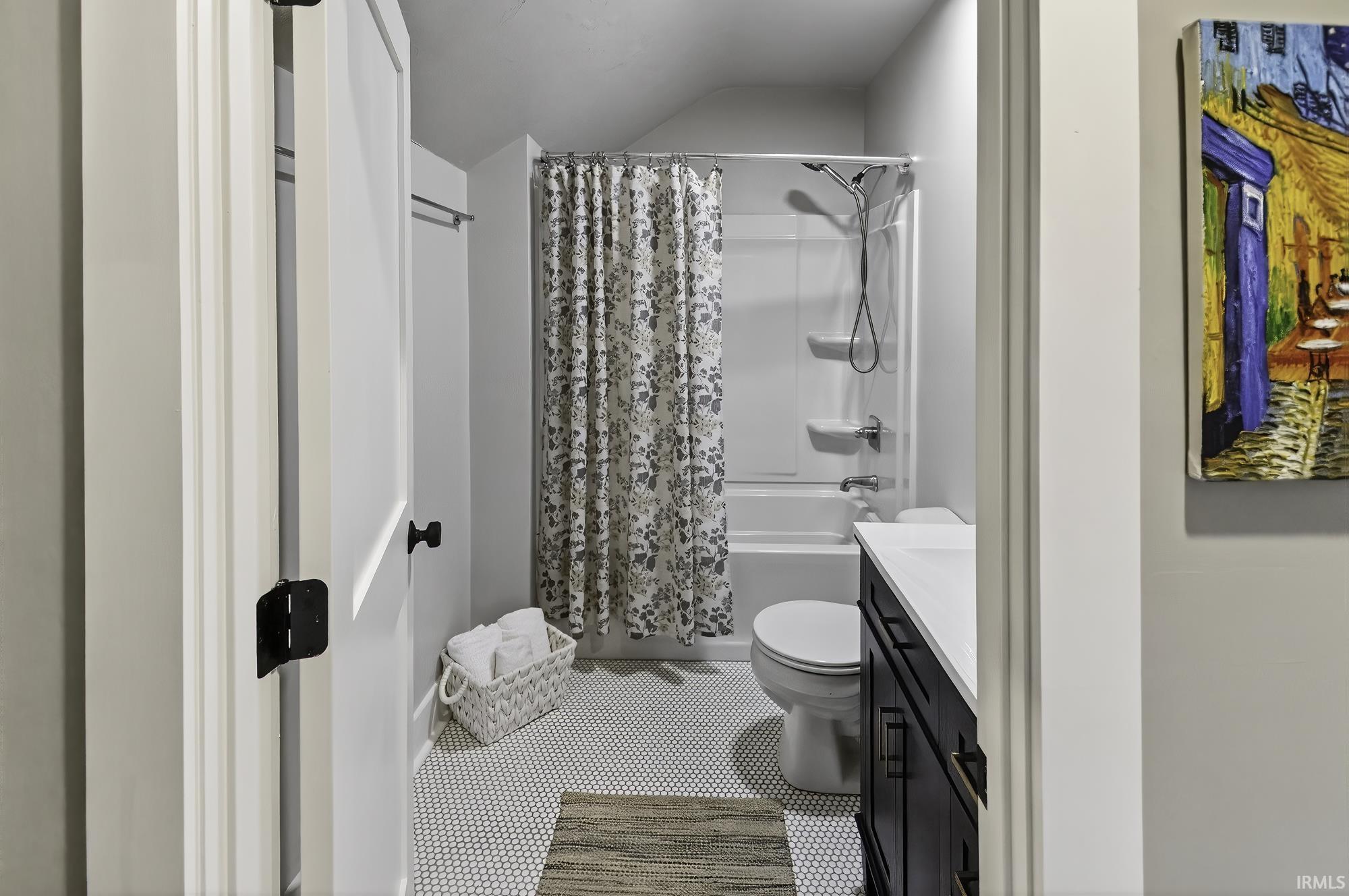 Full bath with shower / bathtub combination with curtain and vanity