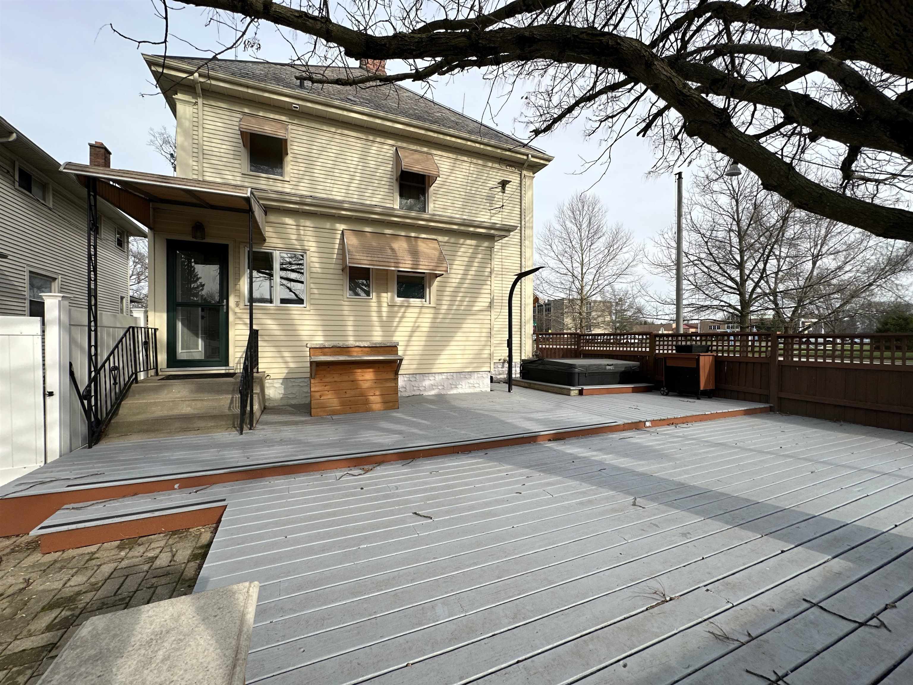Wooden deck with a covered hot tub
