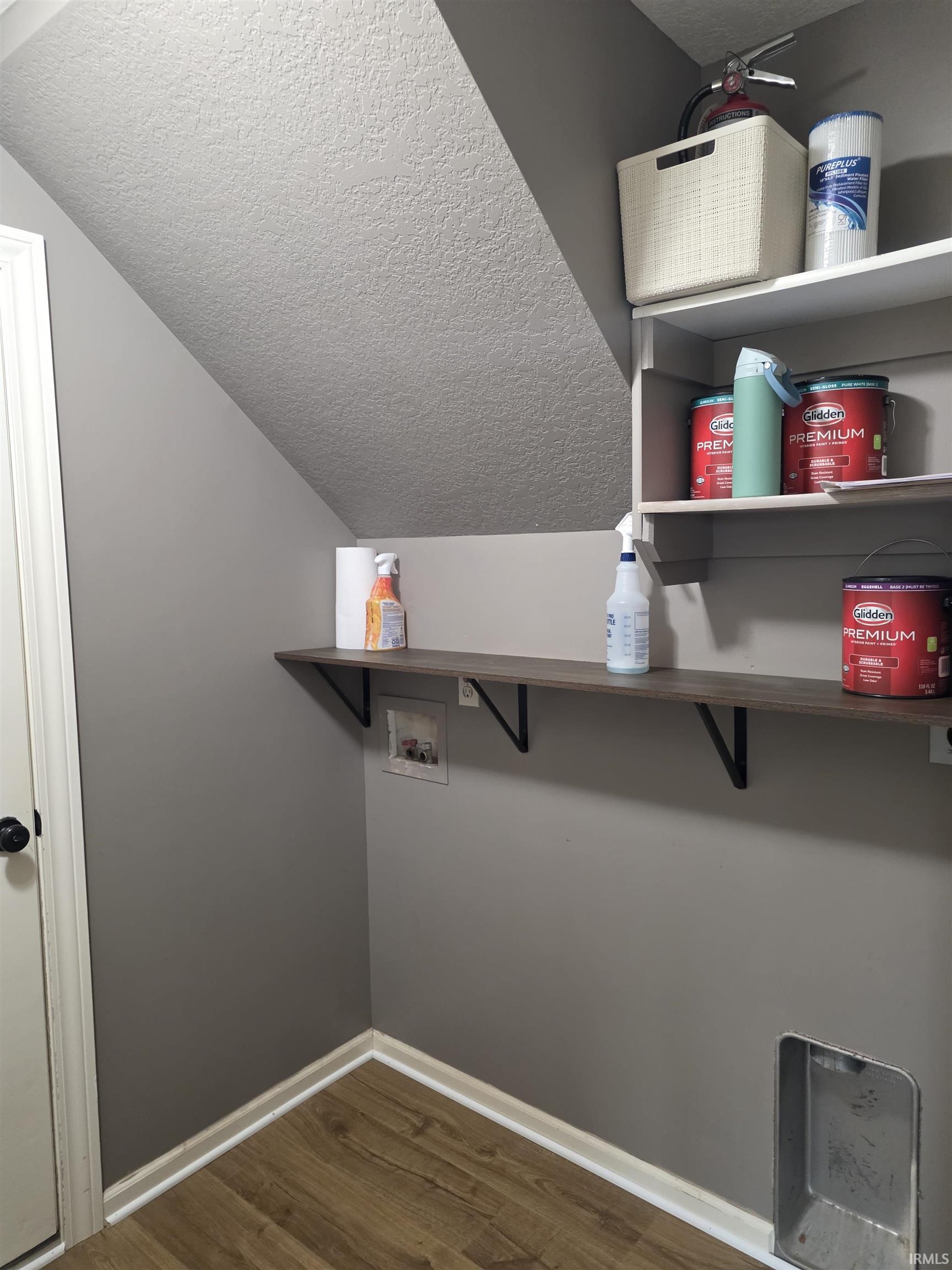 Laundry area featuring washer hookup and dark wood finished floors