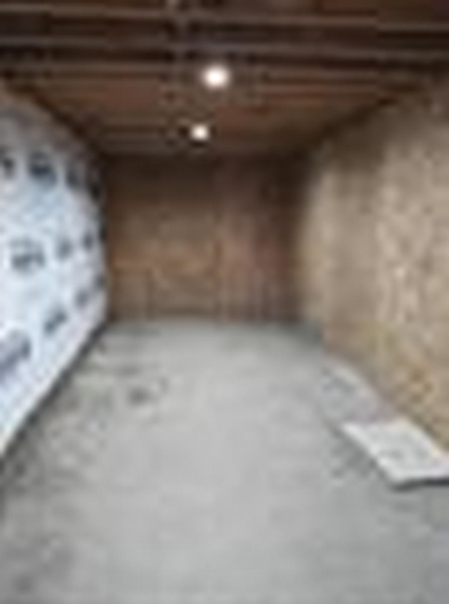 Garage featuring wallpapered walls
