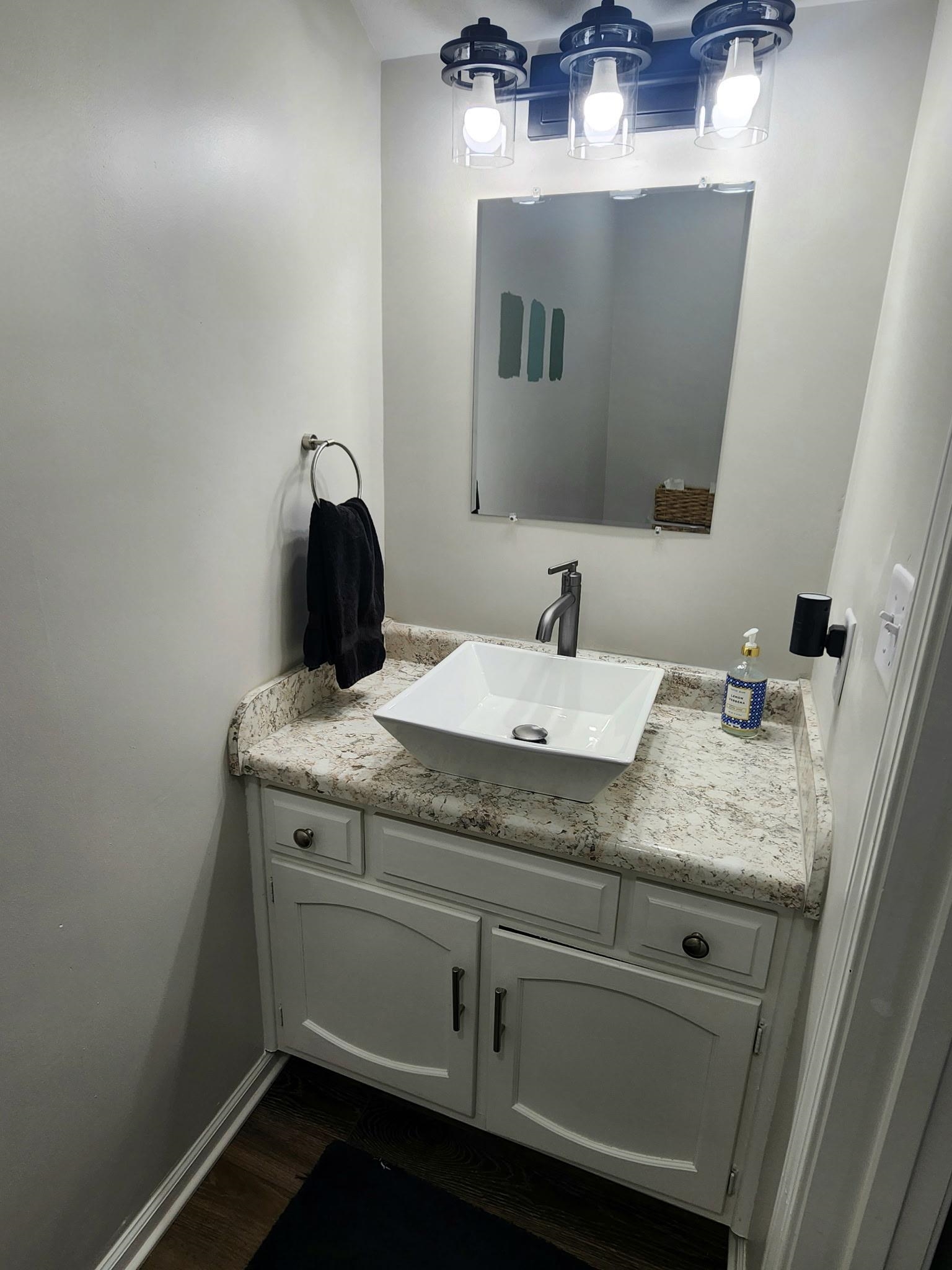 Bathroom with vanity and dark wood finished floors