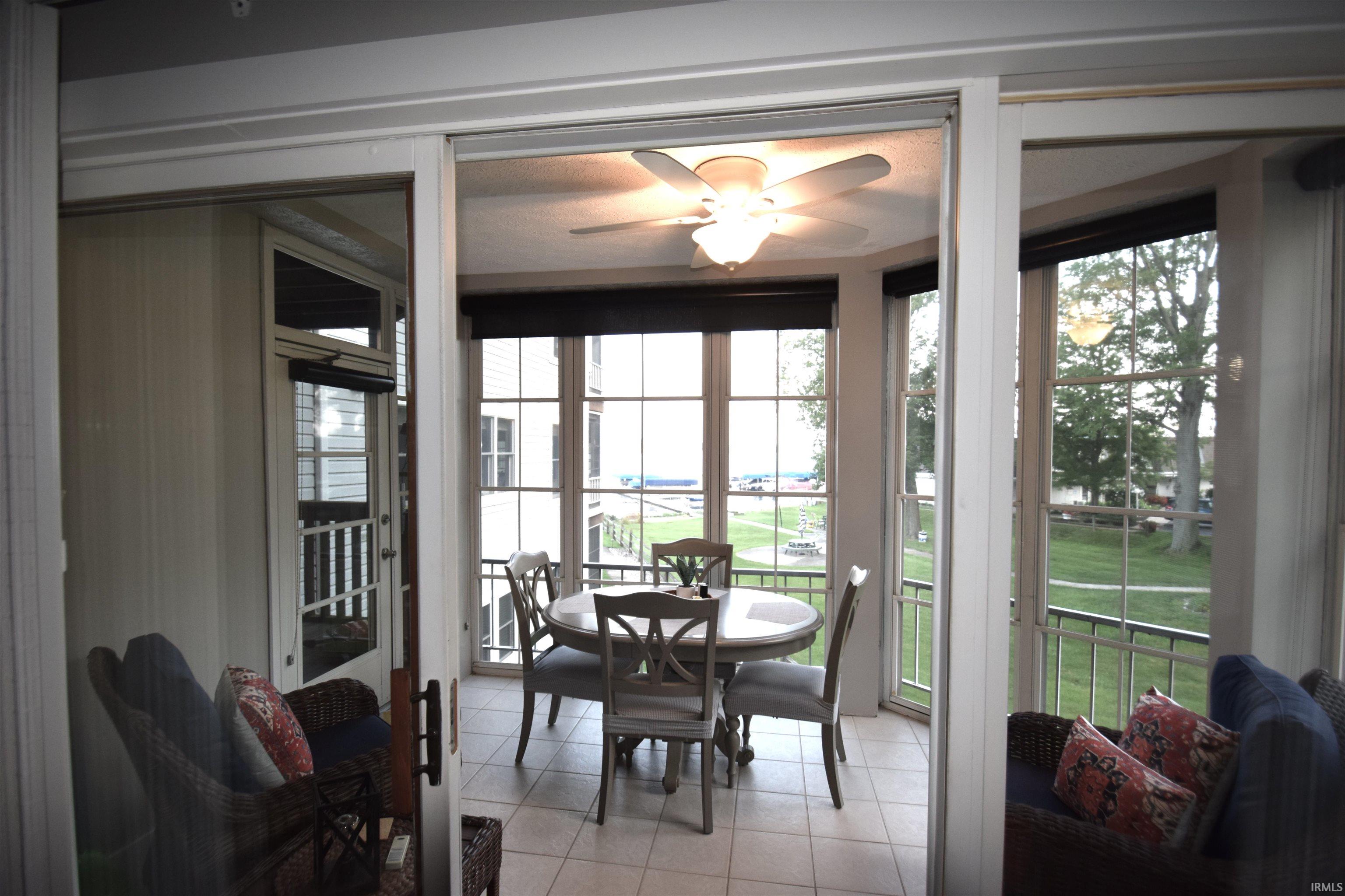 Sunroom / solarium featuring healthy amount of natural light