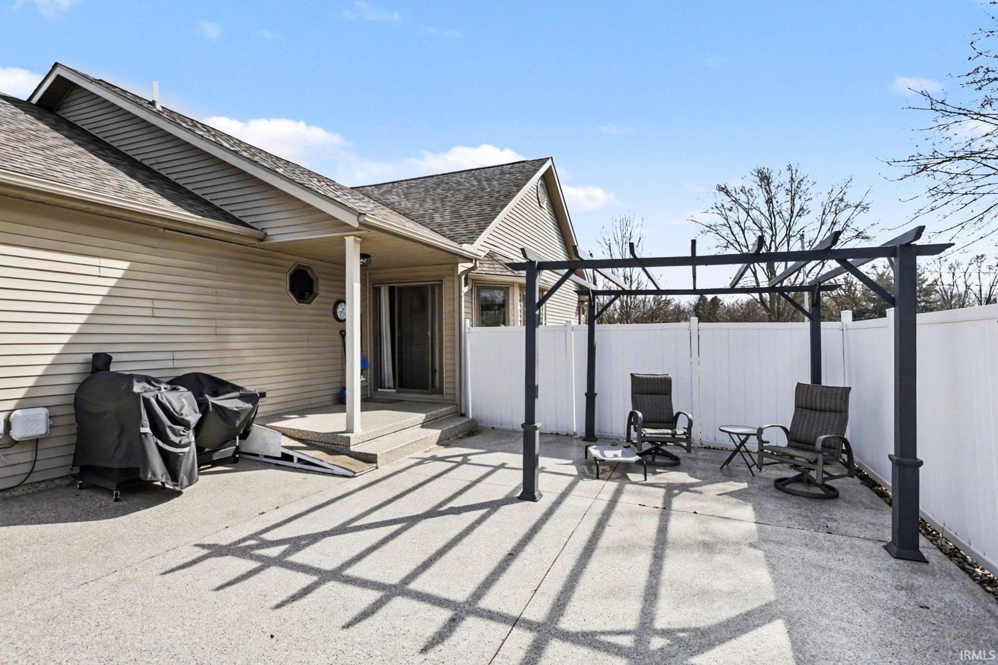 View of patio / terrace with a grill and a pergola