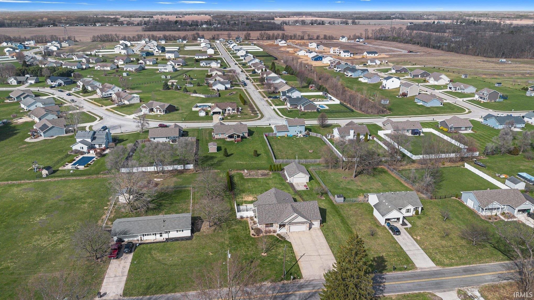 Aerial view of property's location featuring nearby suburban area