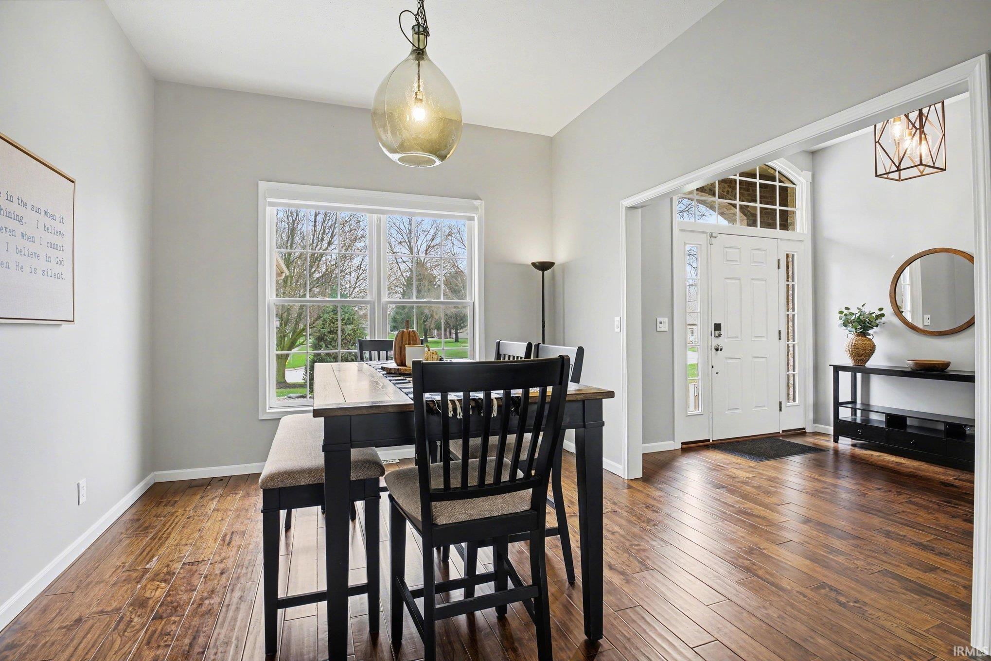 Dining room with dark wood-style floors