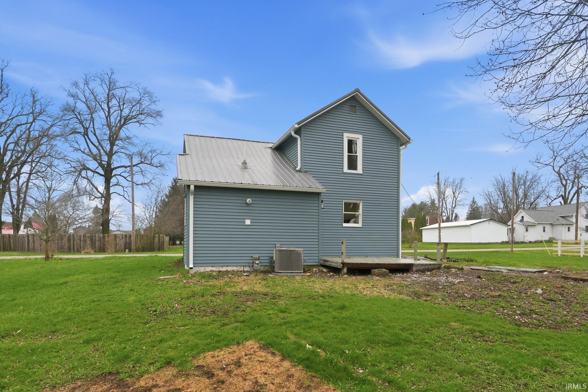 Back of house featuring a metal roof