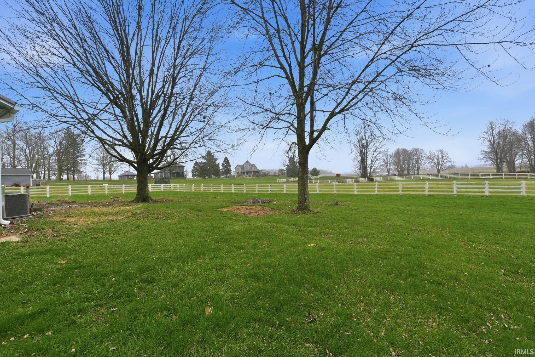 View of yard with a rural view