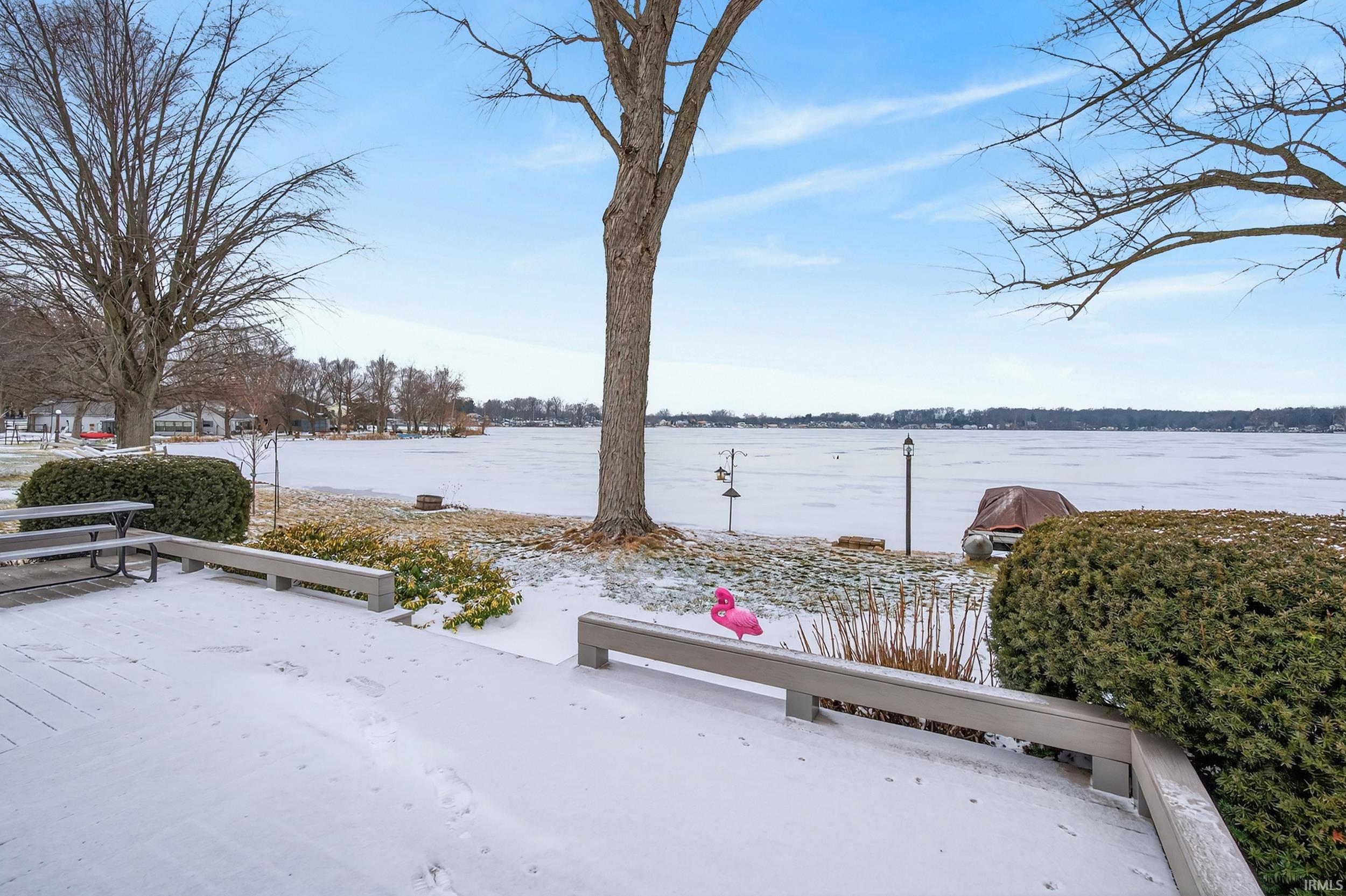 Exterior space featuring a deck with water view